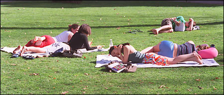 students sunbathing