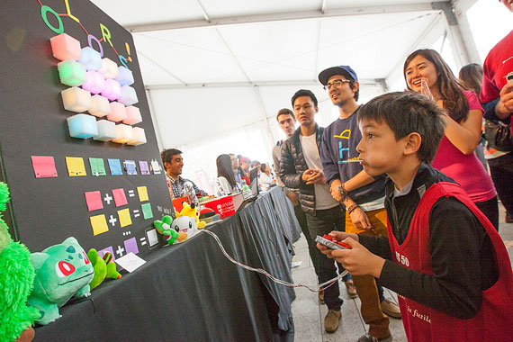 Luka Loncar, 7, tests out an arcade-style game built in ES 50. He is the son of Marko Loncar, Tiantsai Lin Professor of Electrical Engineering, who co-teaches the course.