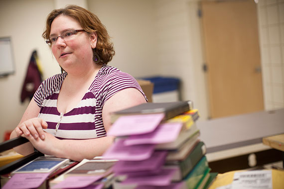 April Duclos finds and scans excerpts from texts to email to patrons via the Scan & Deliver service; the depository also supports InterLibrary Loan, Borrow Direct, and Harvard Direct services. Photos by Stephanie Mitchell/Harvard Staff Photographer