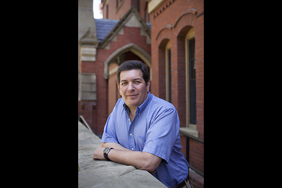 Bloomberg News freelance photographer Neal Hamberg is pictured in Harvard Yard. Photo by Stephanie Mitchell/Harvard Staff Photographer