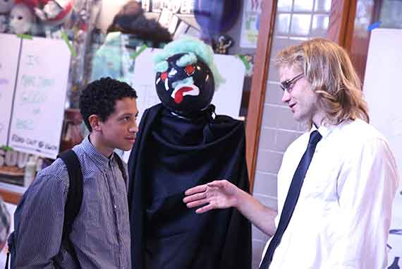 Pedro Cintron and Scott Bustabad talk at the Cambridge-Harvard Summer Academy's annual student exhibition. Photos by Matthew Weber/HGSE Communications