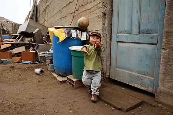 Reyna Cruz, 2, overcame his shyness and language delays after he received help from Socios En Salud as part of an early childhood development program. Like his brother, Rafael, more than 120 children at risk of developmental delays have been helped by Project CASITA, a program Socios En Salud started in 2013.