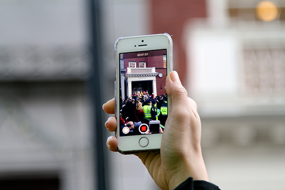 An onlooker tries for the perfect Snapchat. Photo by Shraddha Gupta