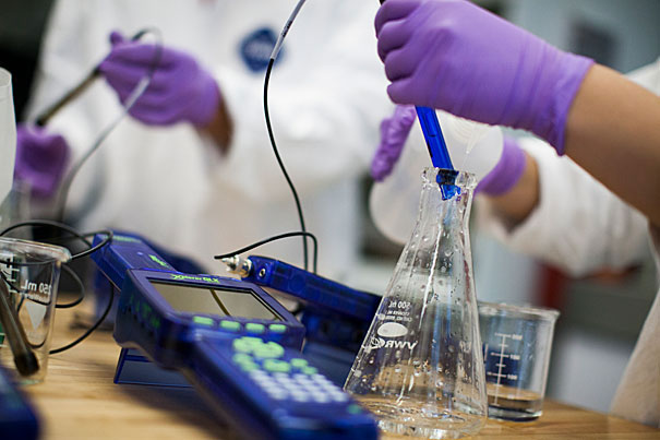 A student tests water samples in a Pierce Hall laboratory at Harvard University.