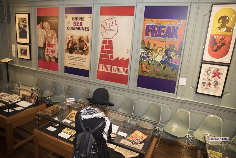 Talulah Whitehead, a visitor from Australia, views the “Altered States” exhibit at Houghton Library. Kris Snibbe/Harvard Staff Photographer