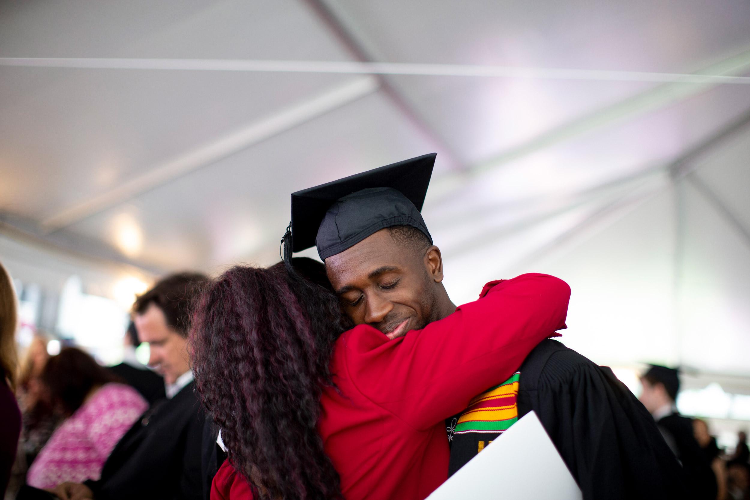 Razaak Eniola, Jr. hugs his mother