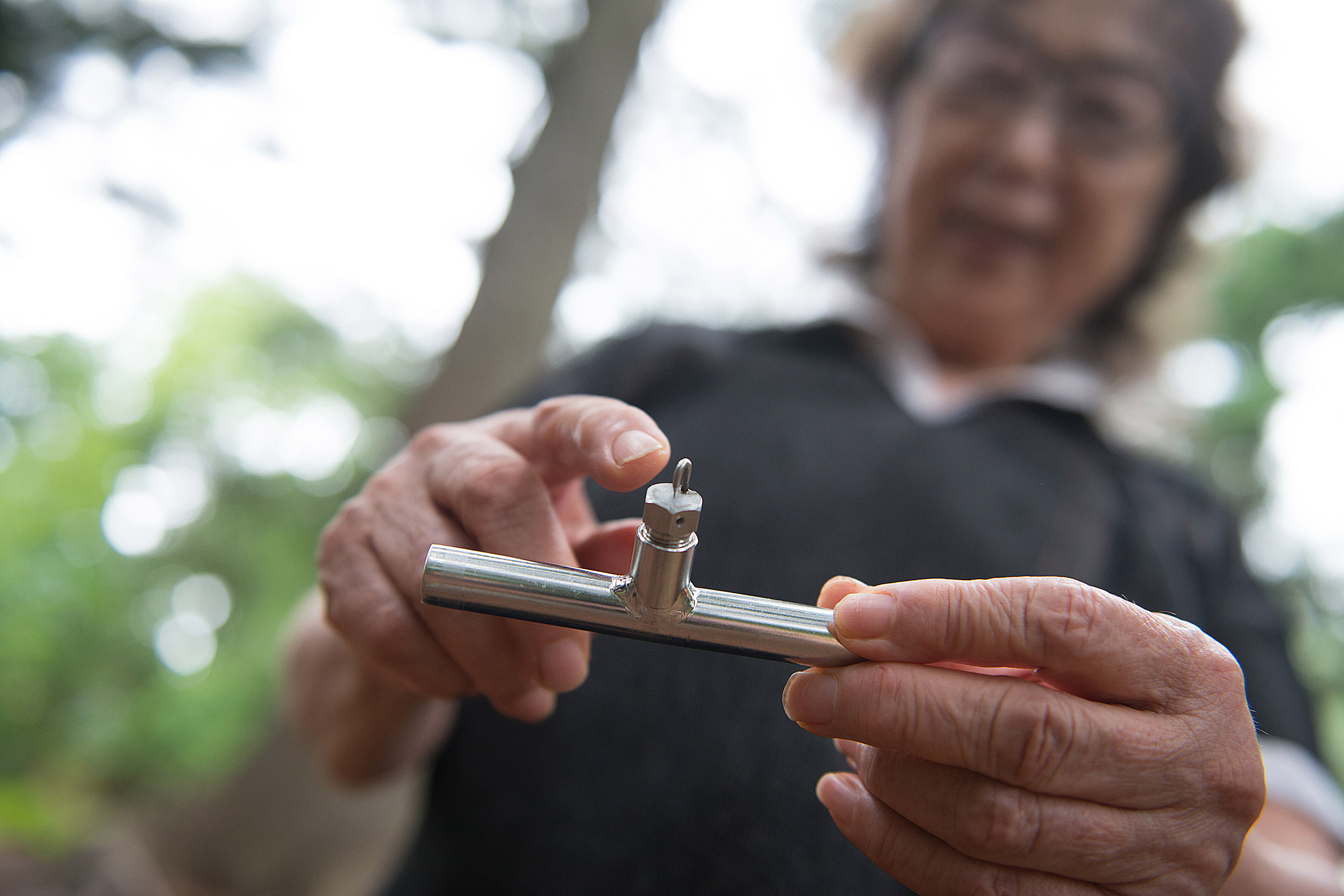 Fujiko Nakaya shows nozzle she patented for fog art.