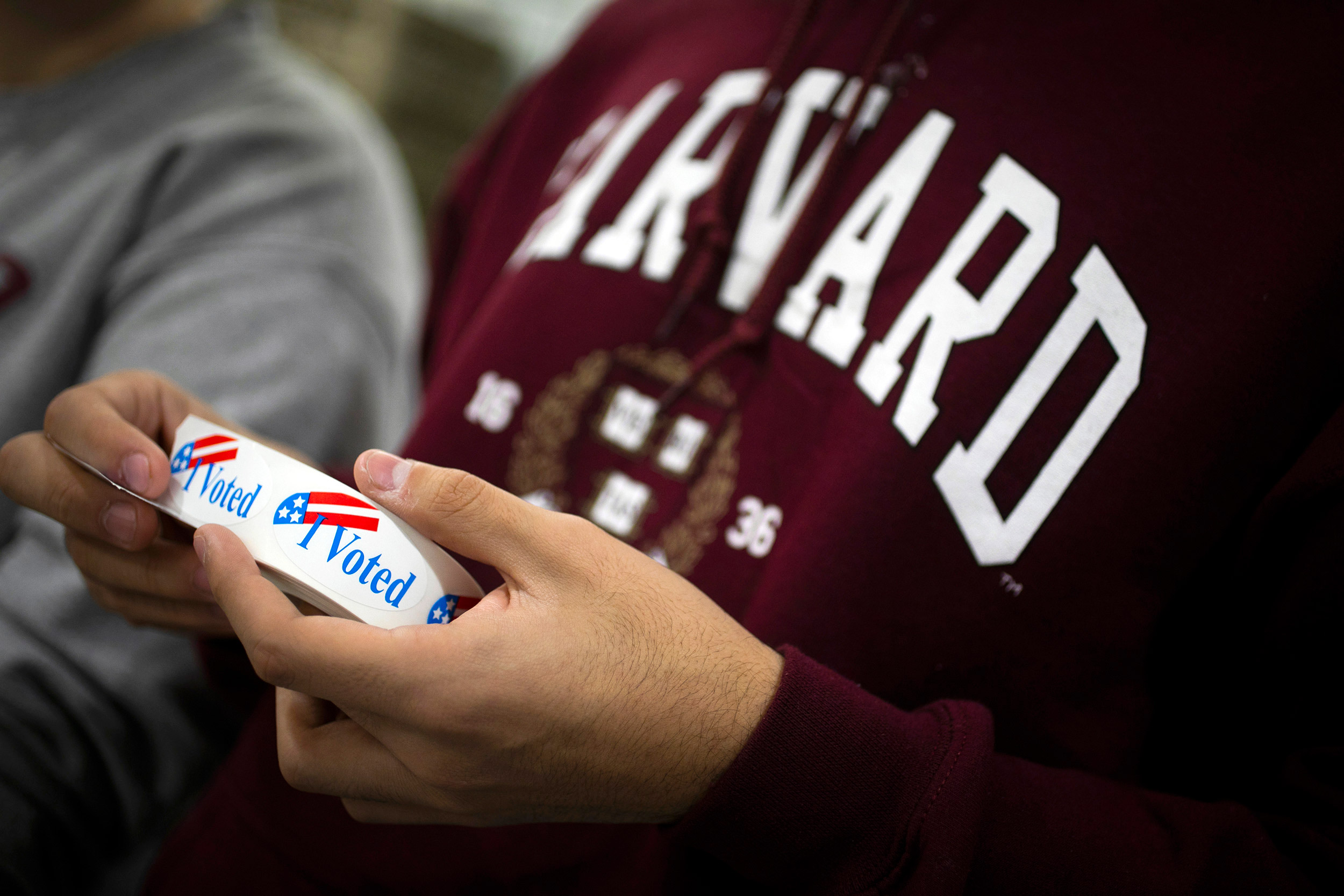 Student holding I voted stickers..