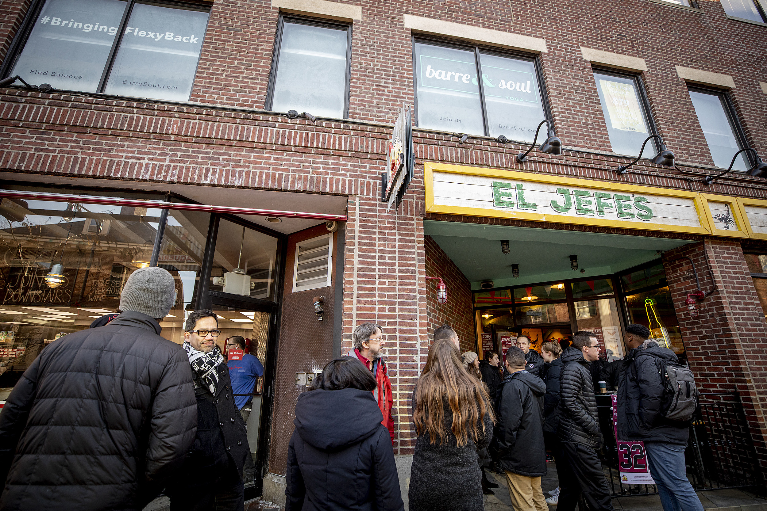 People in line in front of a Mexican restaurant