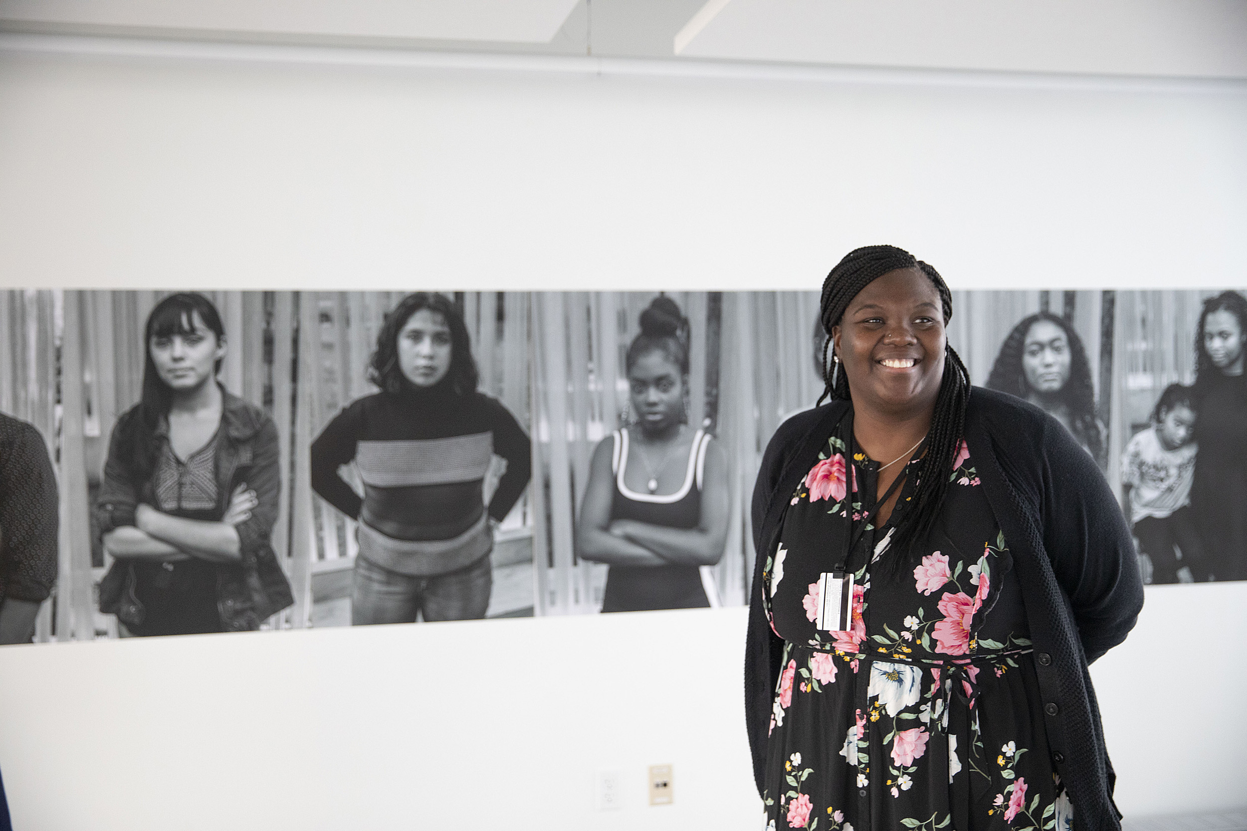 Tracey-Ann Daley stands in the gallery.