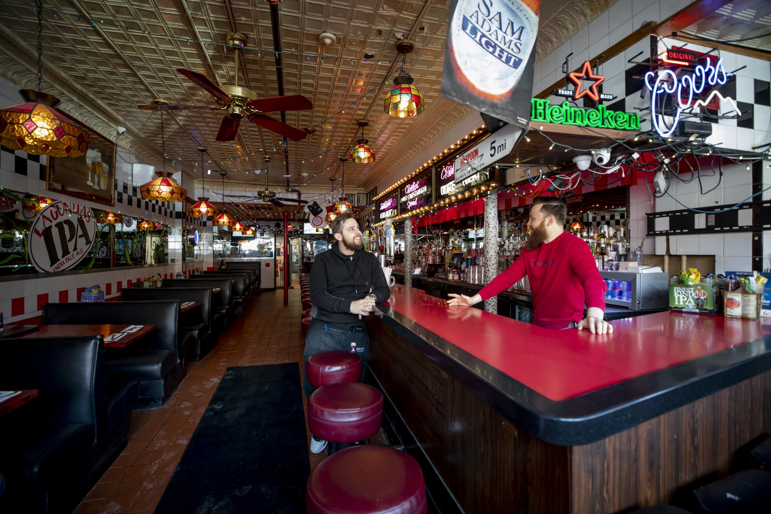 A bartender and a waiter in Charlie's Kitchen.