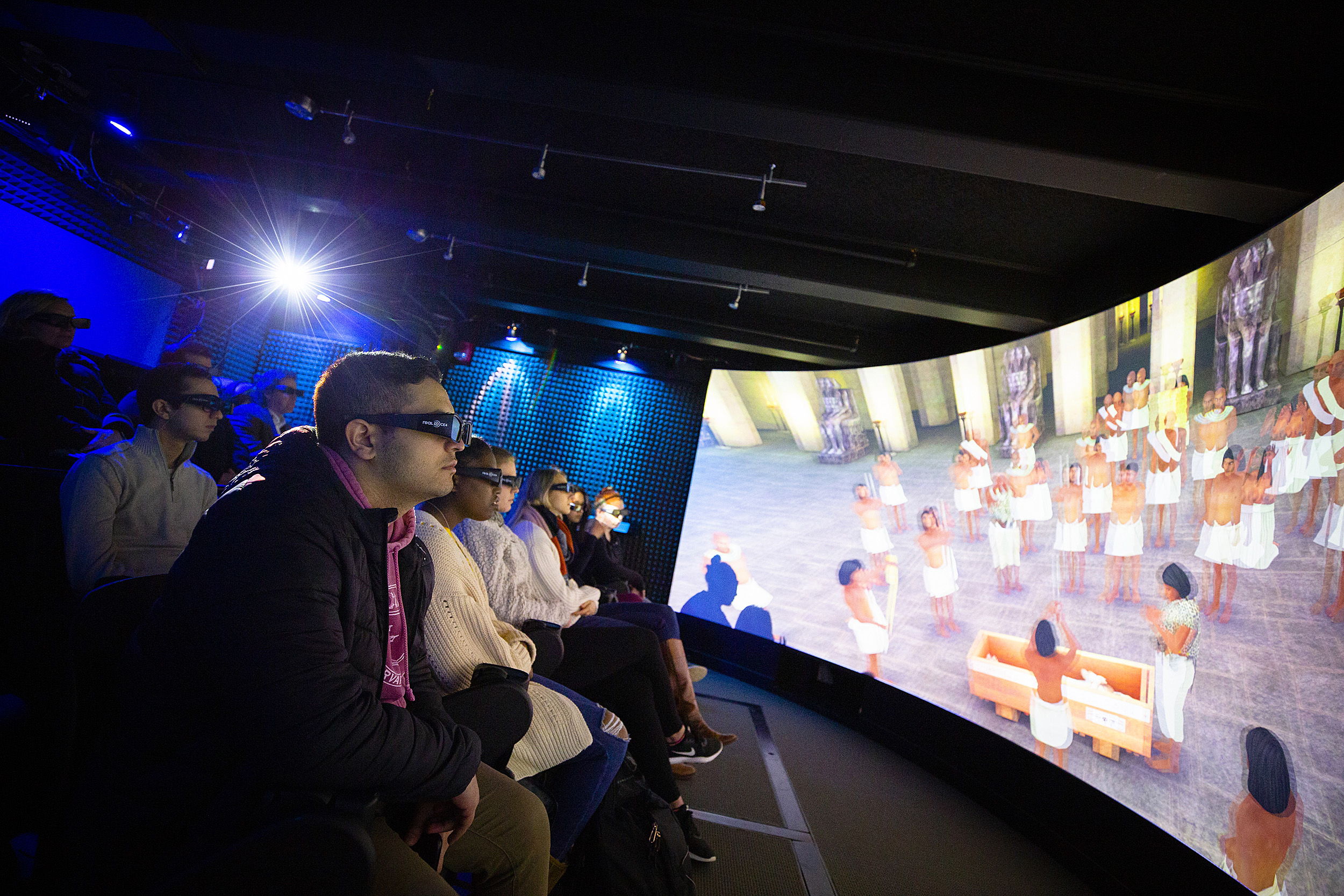 Students wearing 3D glasses view a visualization of an Egyptian tomb.