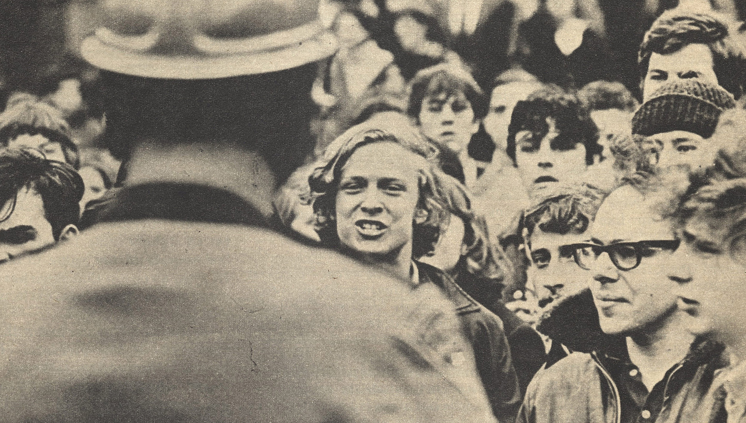 Protesters face police.