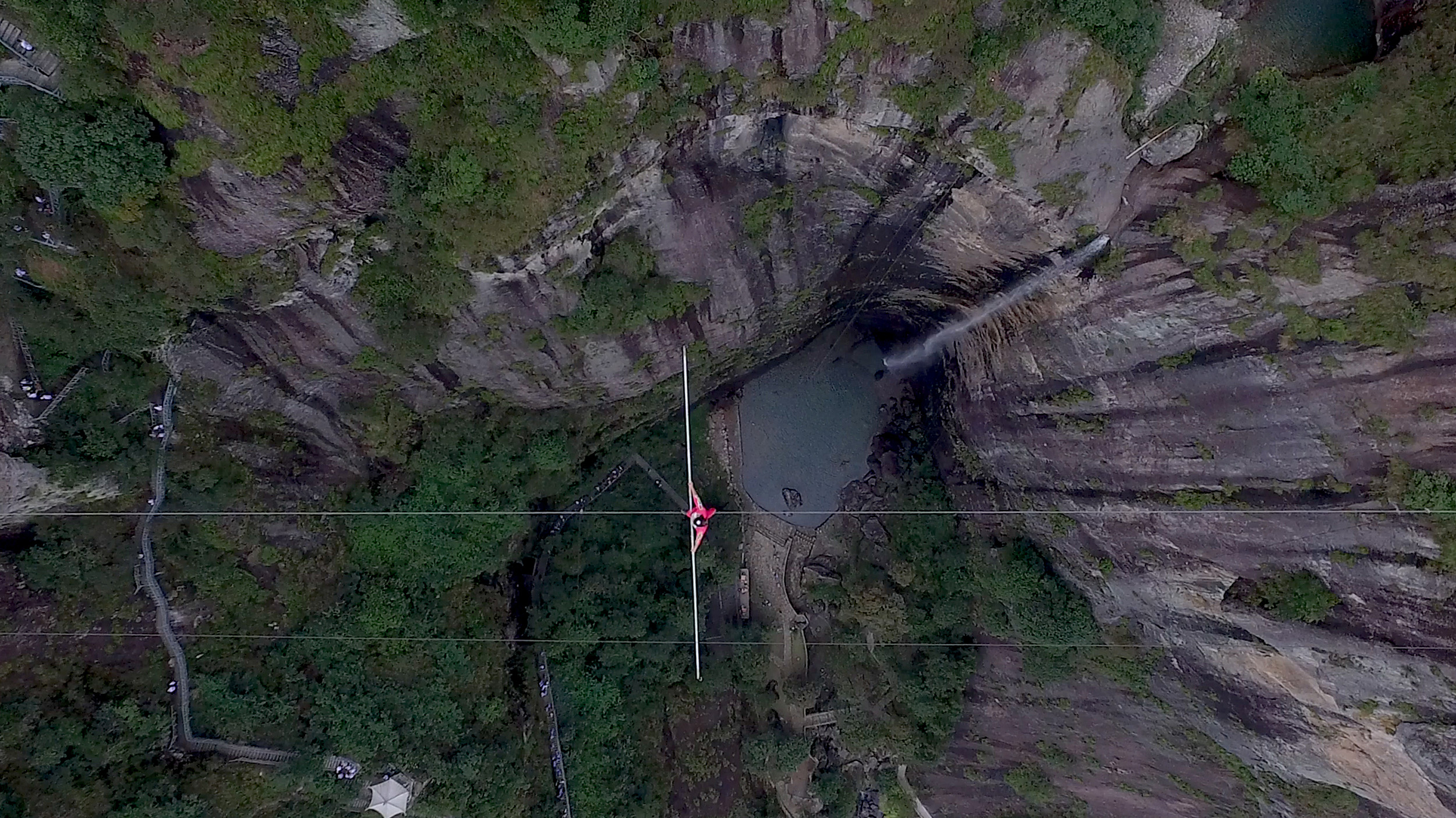 Tightrope walker over a canyon