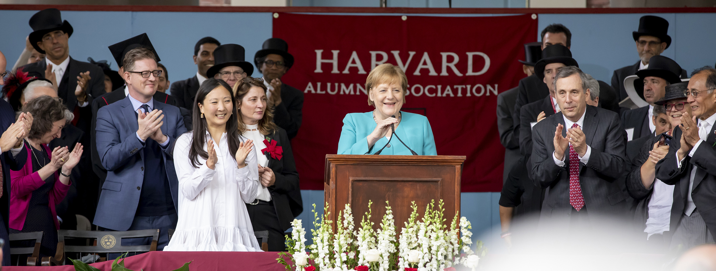 Angela Merkel speaks from podium.