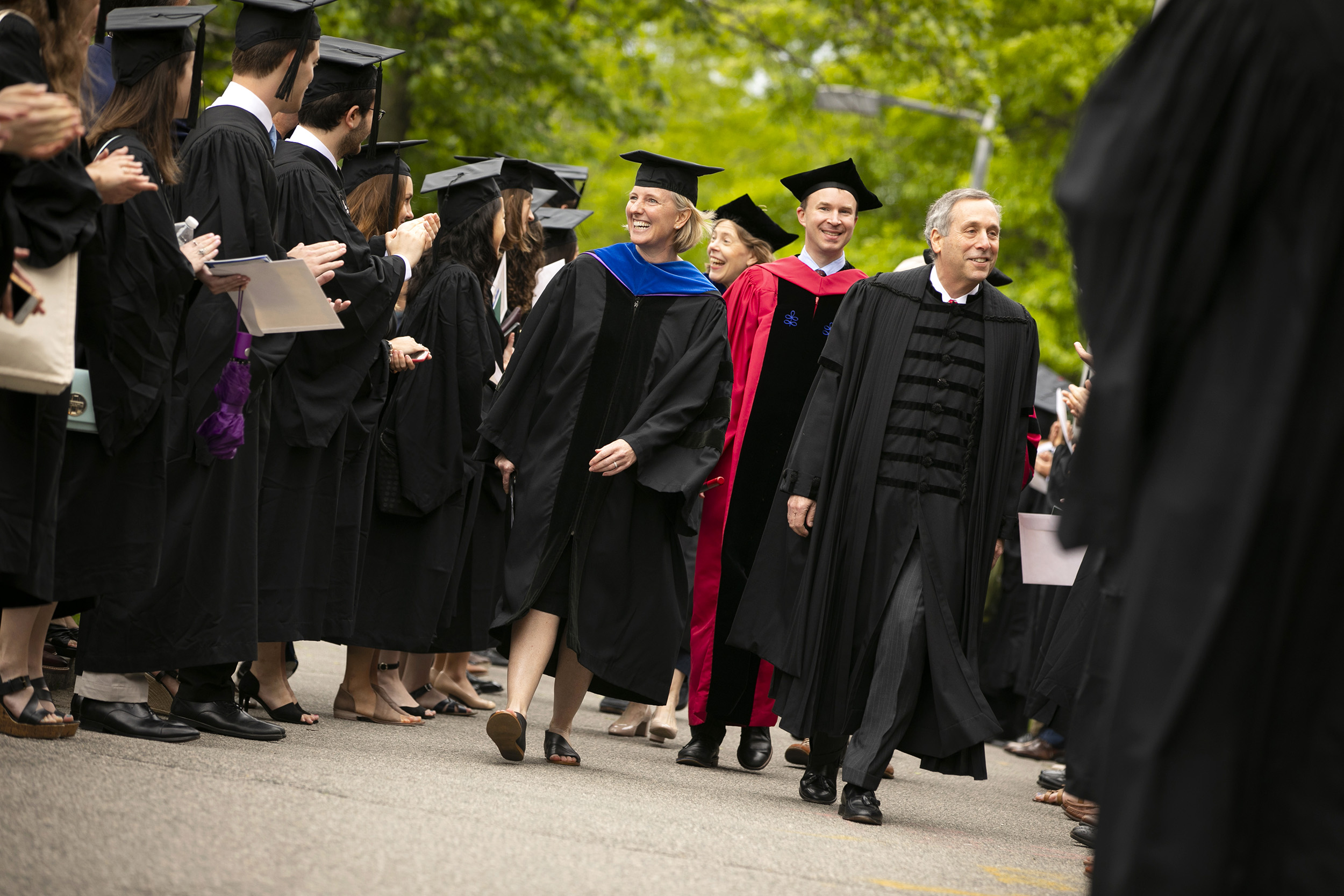 Hopi Hoekstra, Logan McCarthy, and Harvard President Larry Bacow process through the seniors on their way to Phi Beta Kappa Literary Exercises.