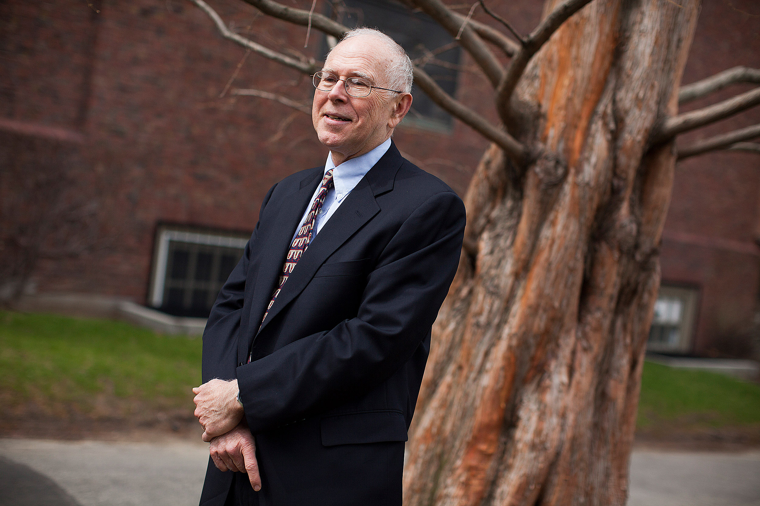 Michael McCormick standing with a tree