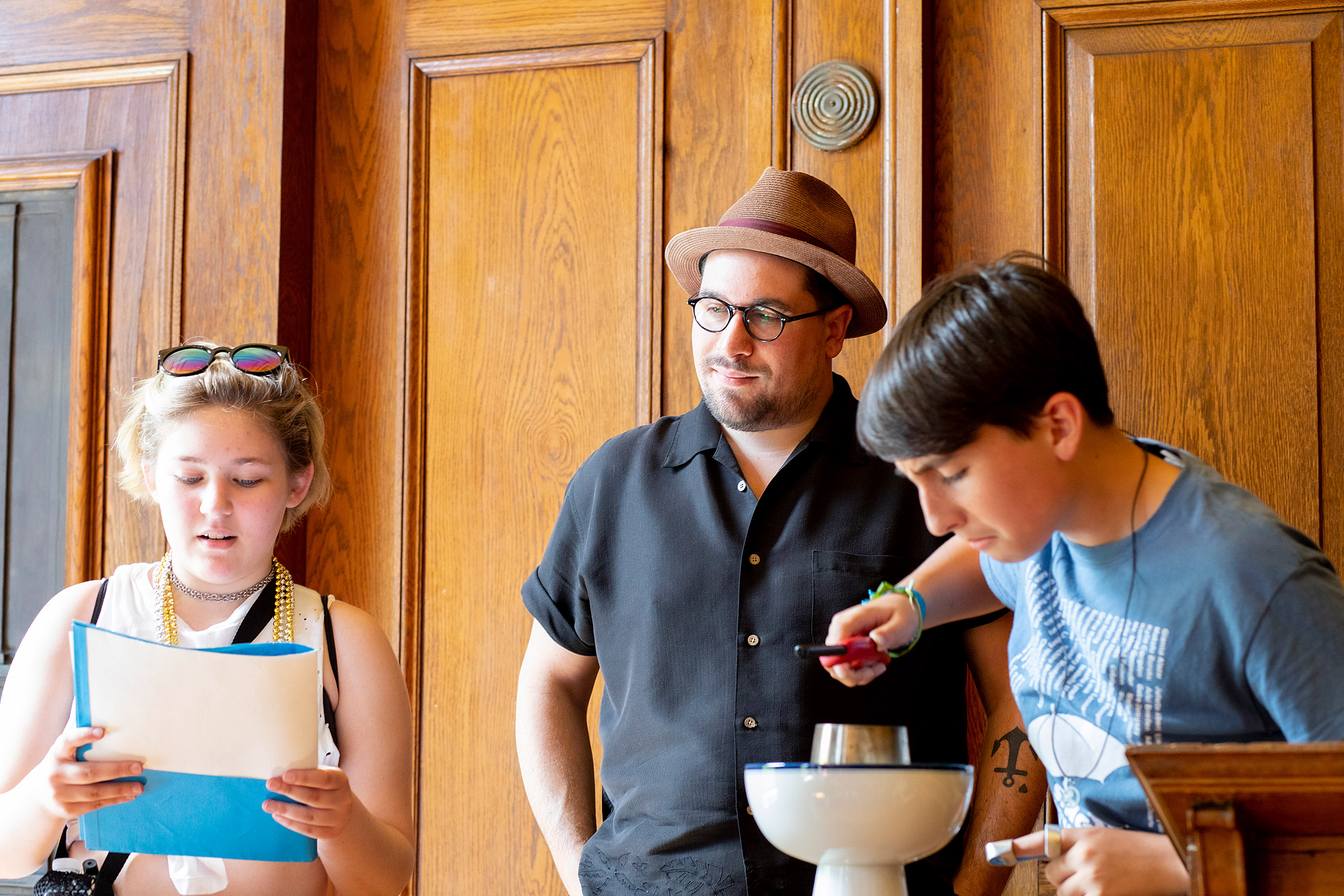 A visitor lights a candle during Israel Buffardi's tour at the Divinity School.