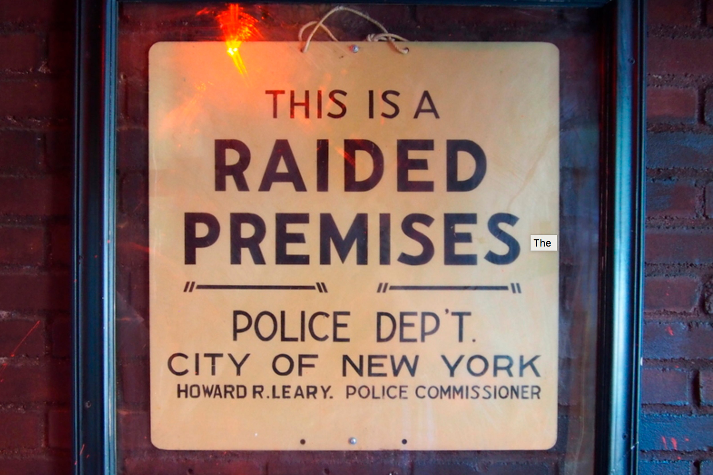 The "raided premises" sign just inside the door at the Stonewall Inn.