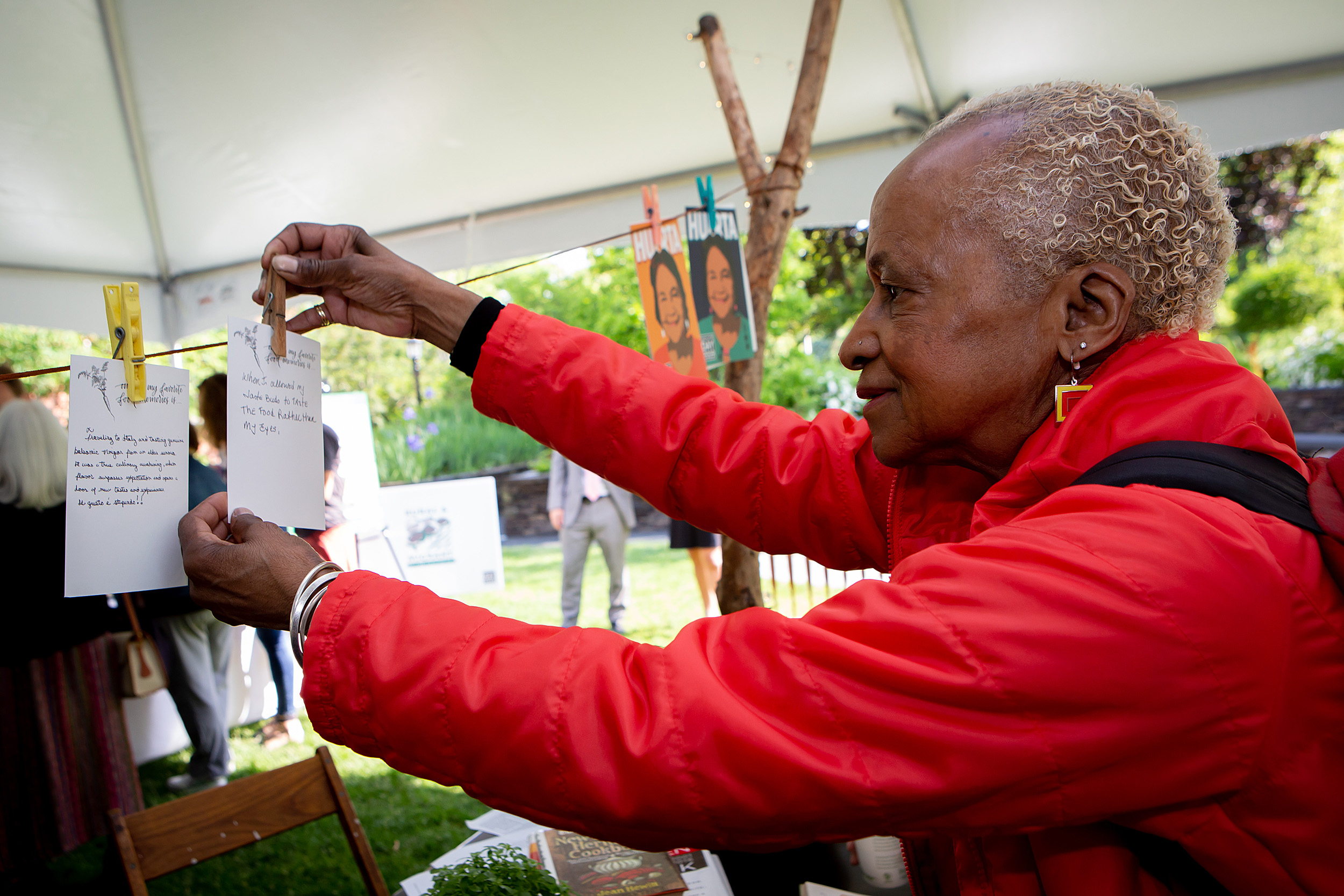 A visitor clips a food memory to the line.