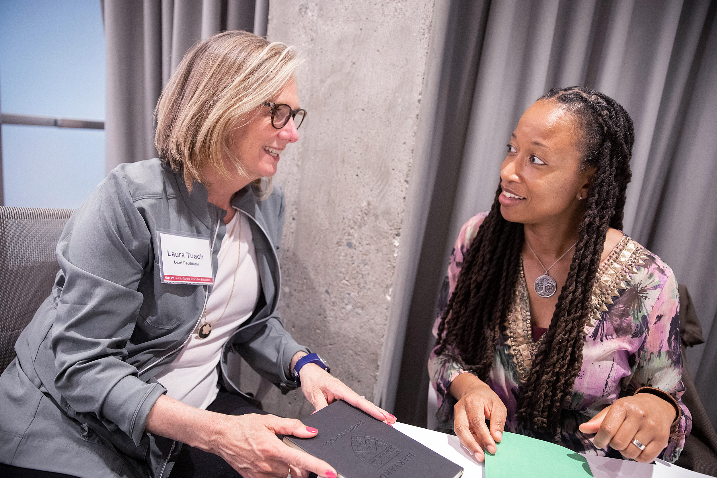 Two women speaking to each other