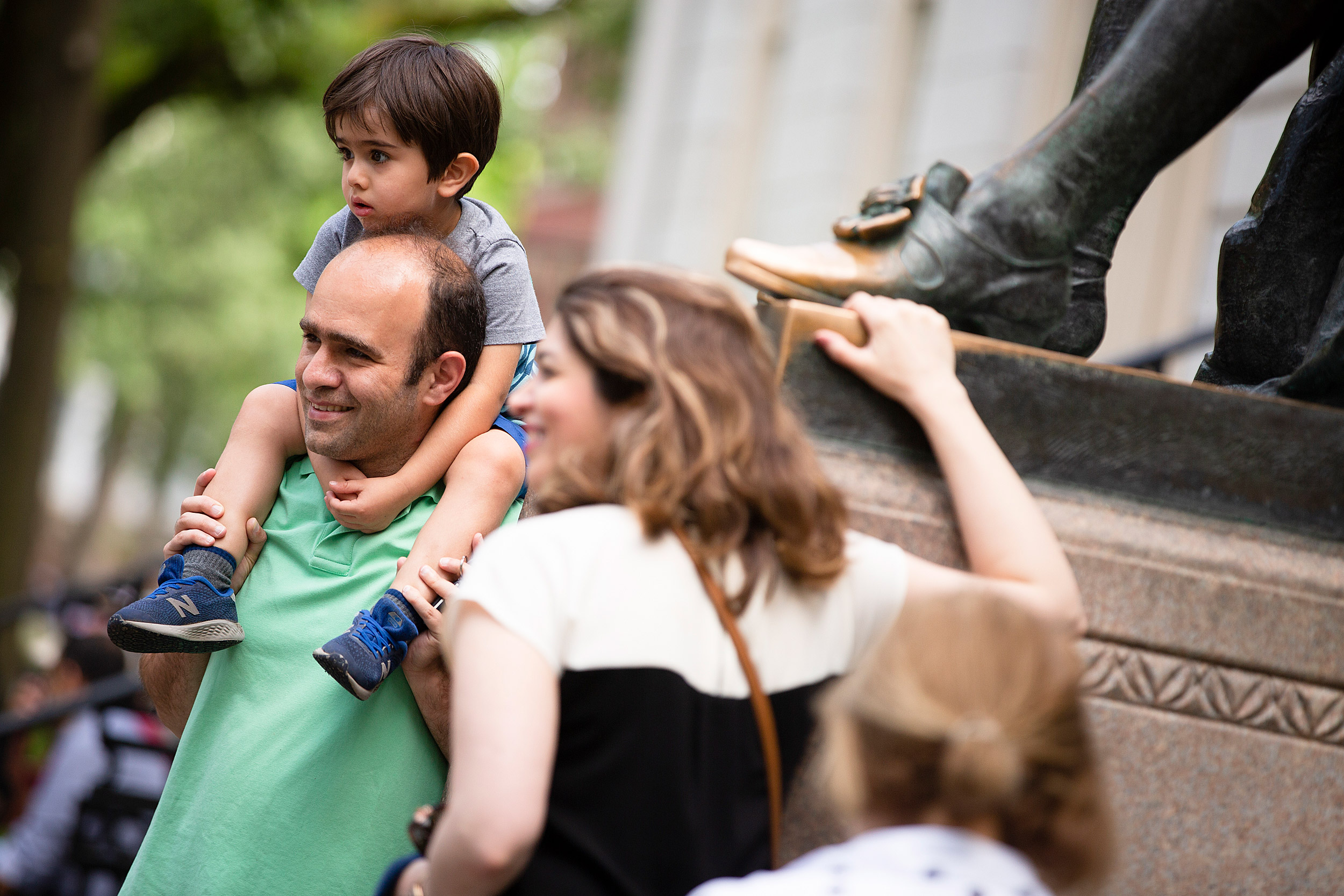 A family from Tehran poses by the statue.