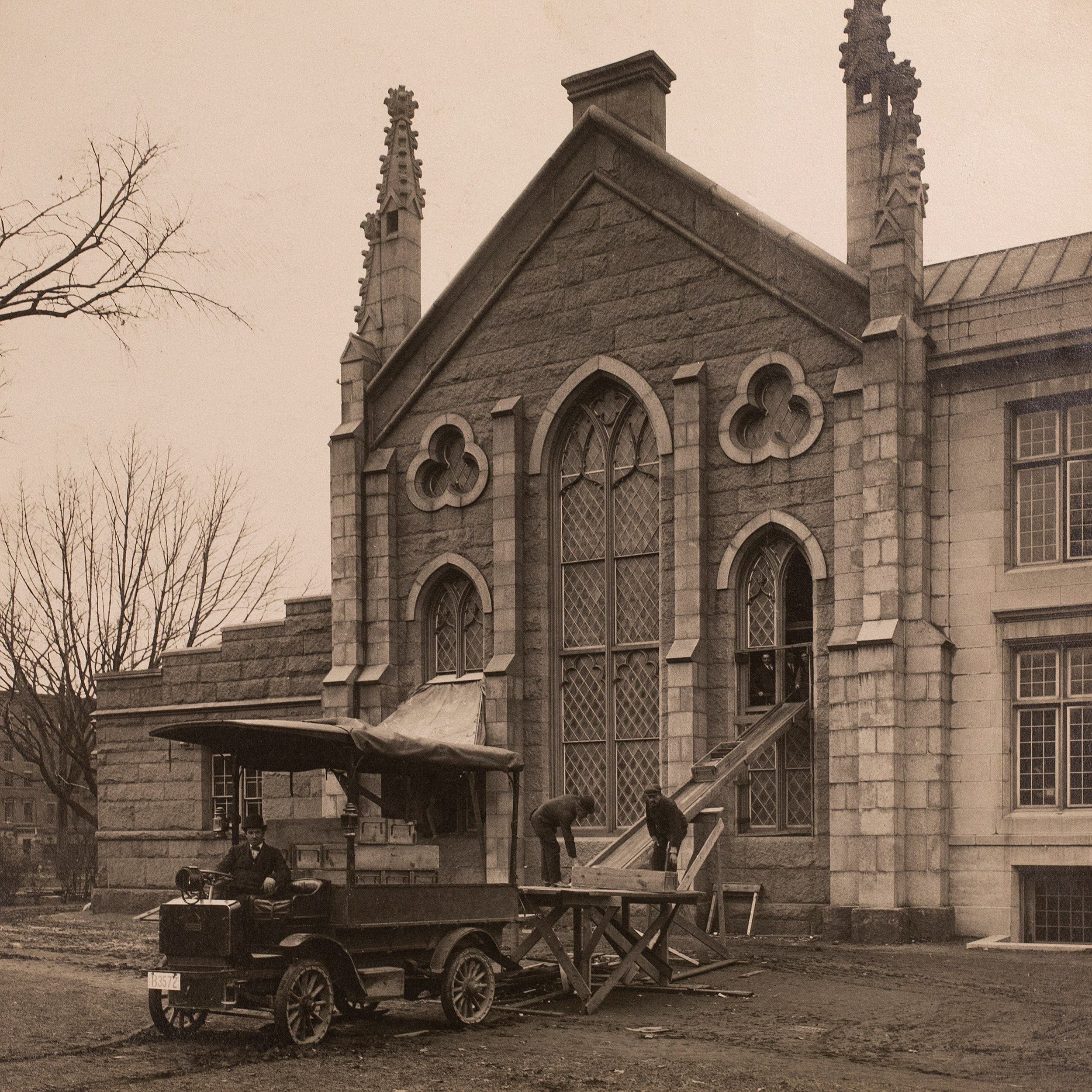 Books are removed from a library window via chute onto a buggy.