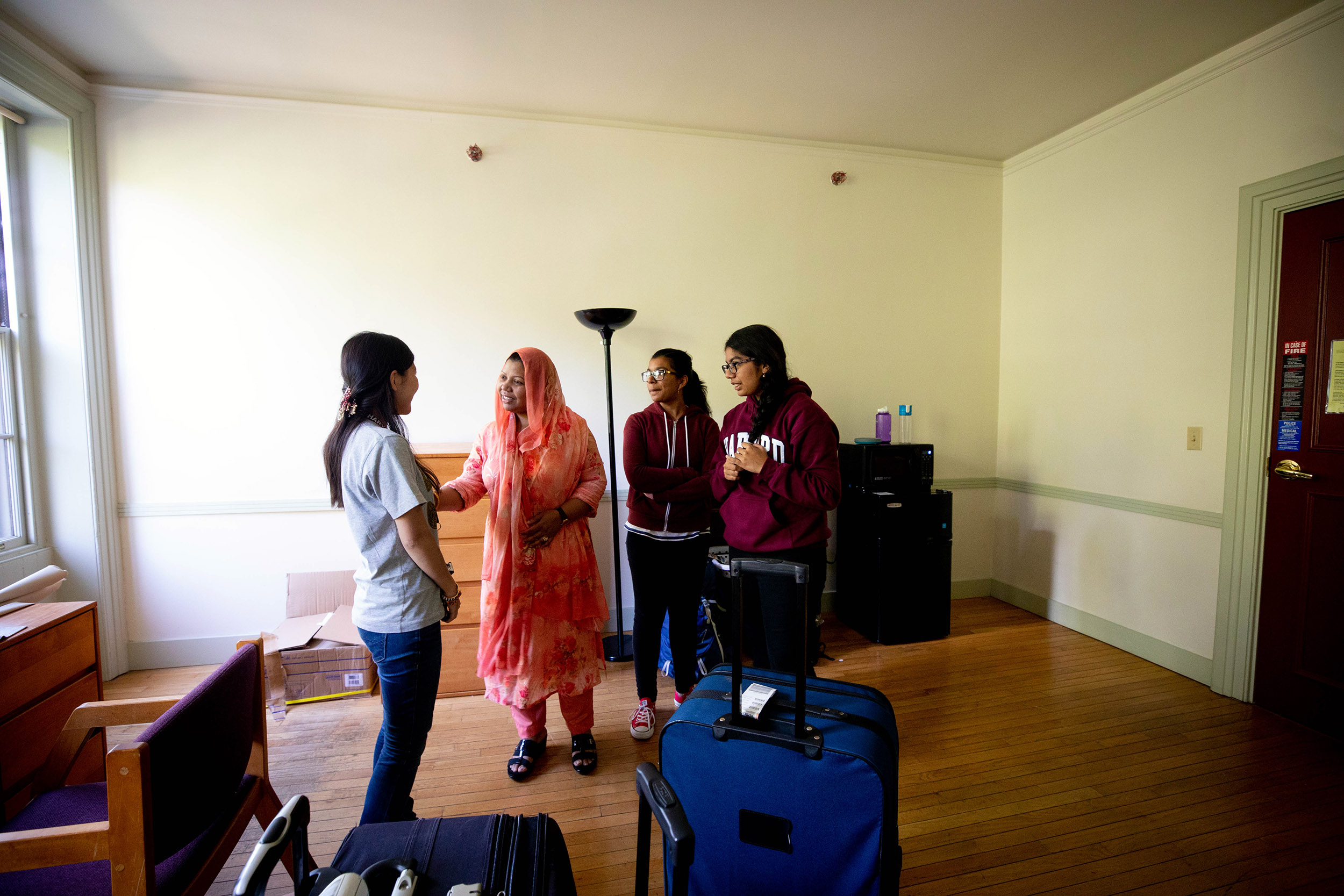 Family dropping off a student in her room