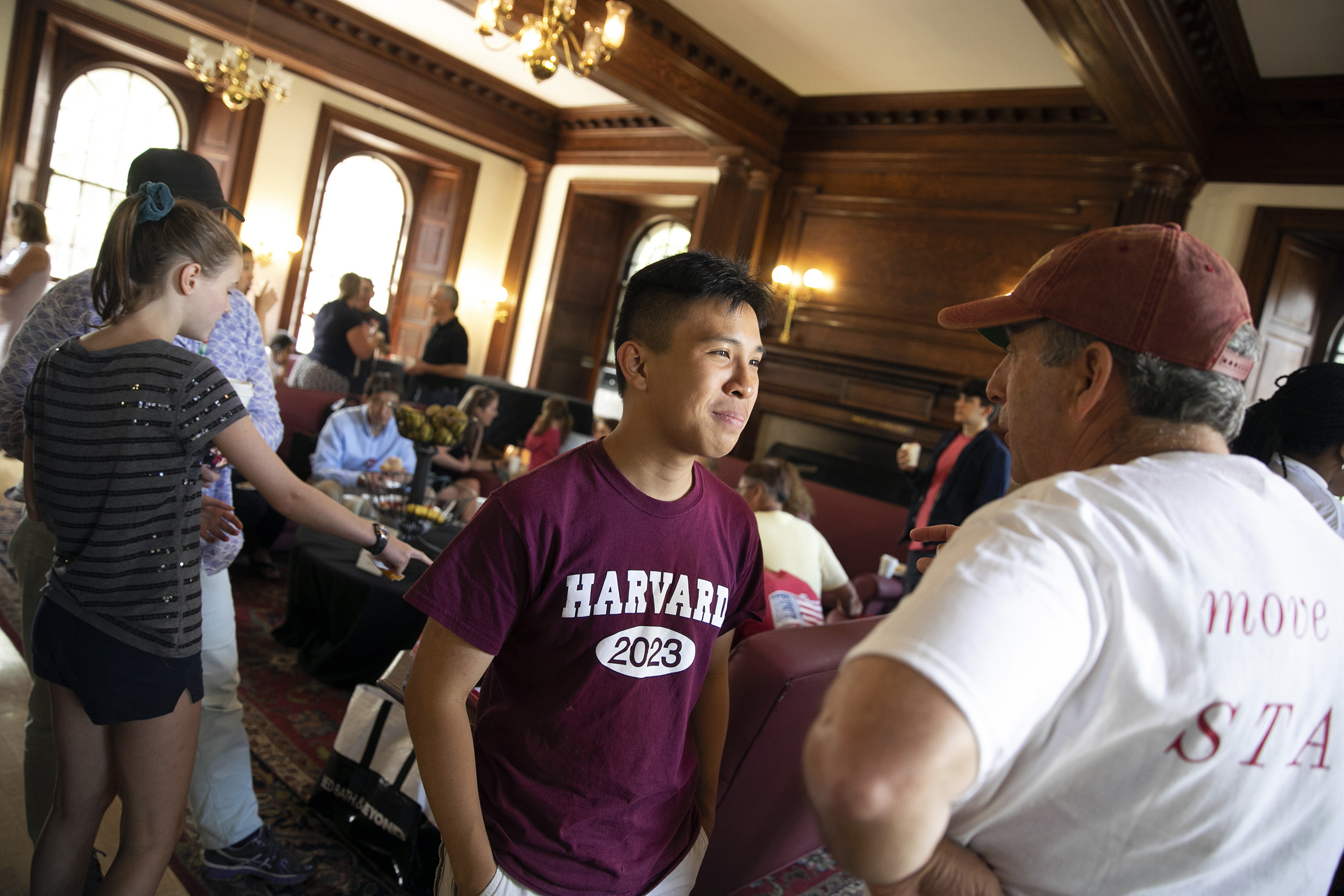 Larry Bacow speaks with a student