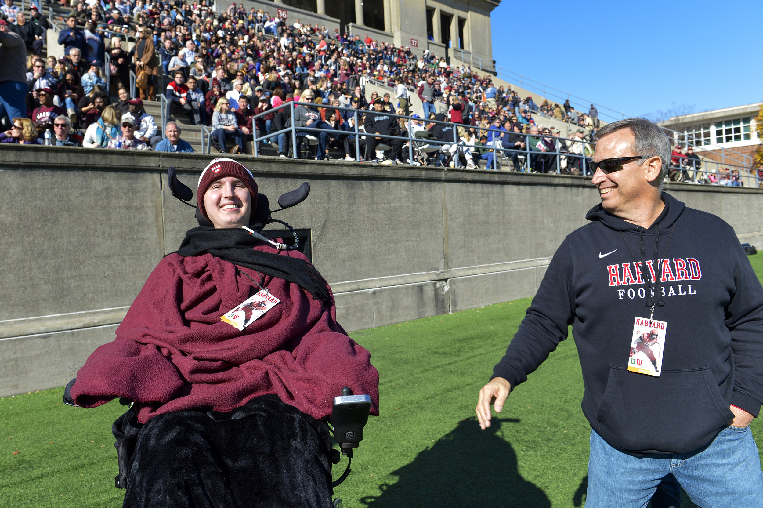 Ben Abercrombie ’23 and his father, Marty, enjoy a moment on the sideline during the game