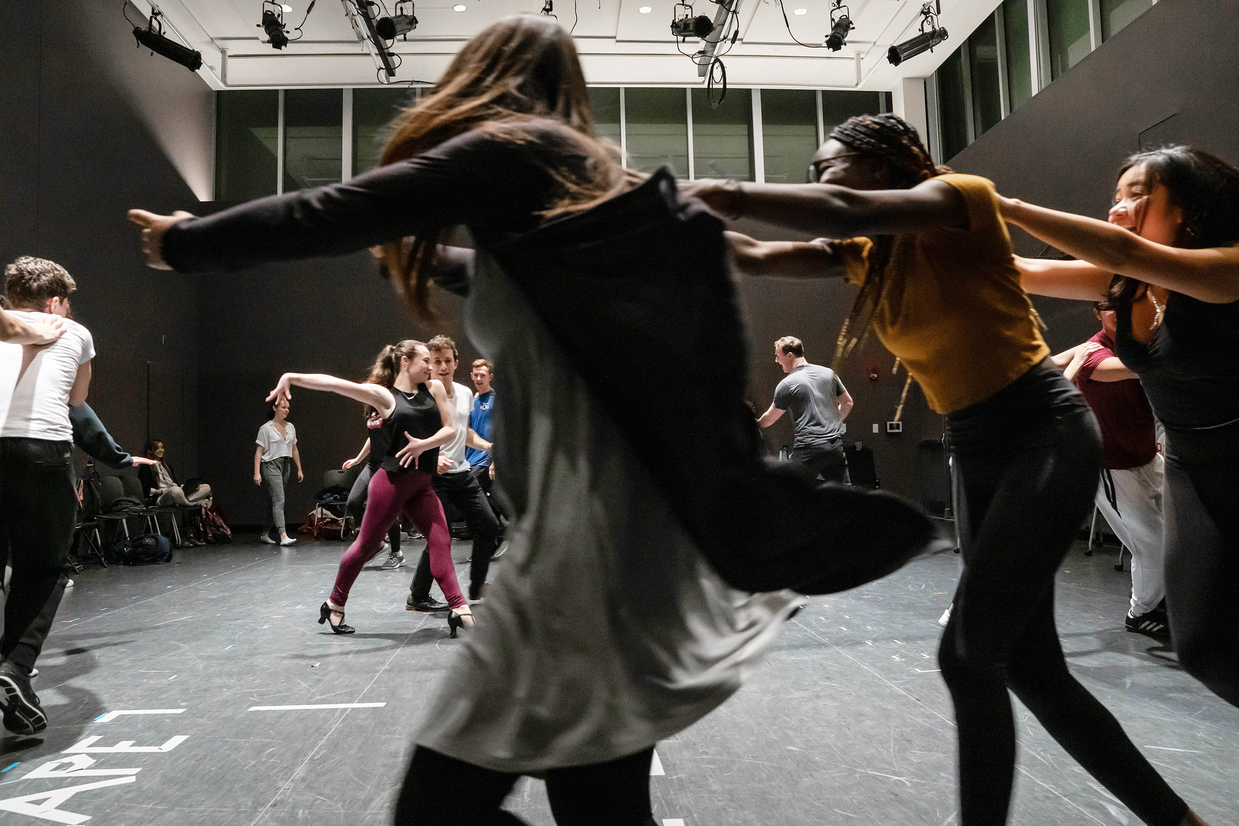 Cast members rehearse West Side Story