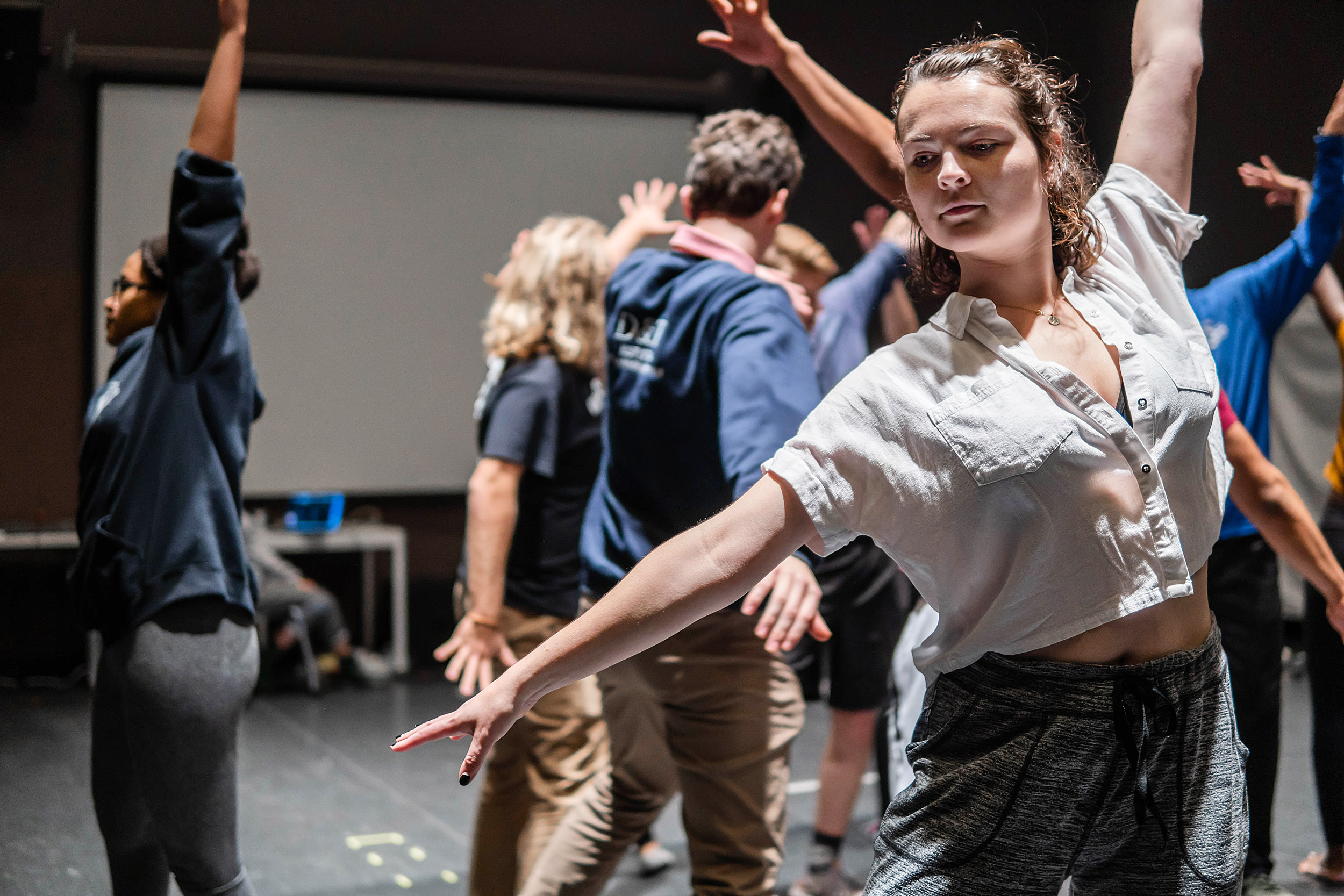 Performers rehearse choreography