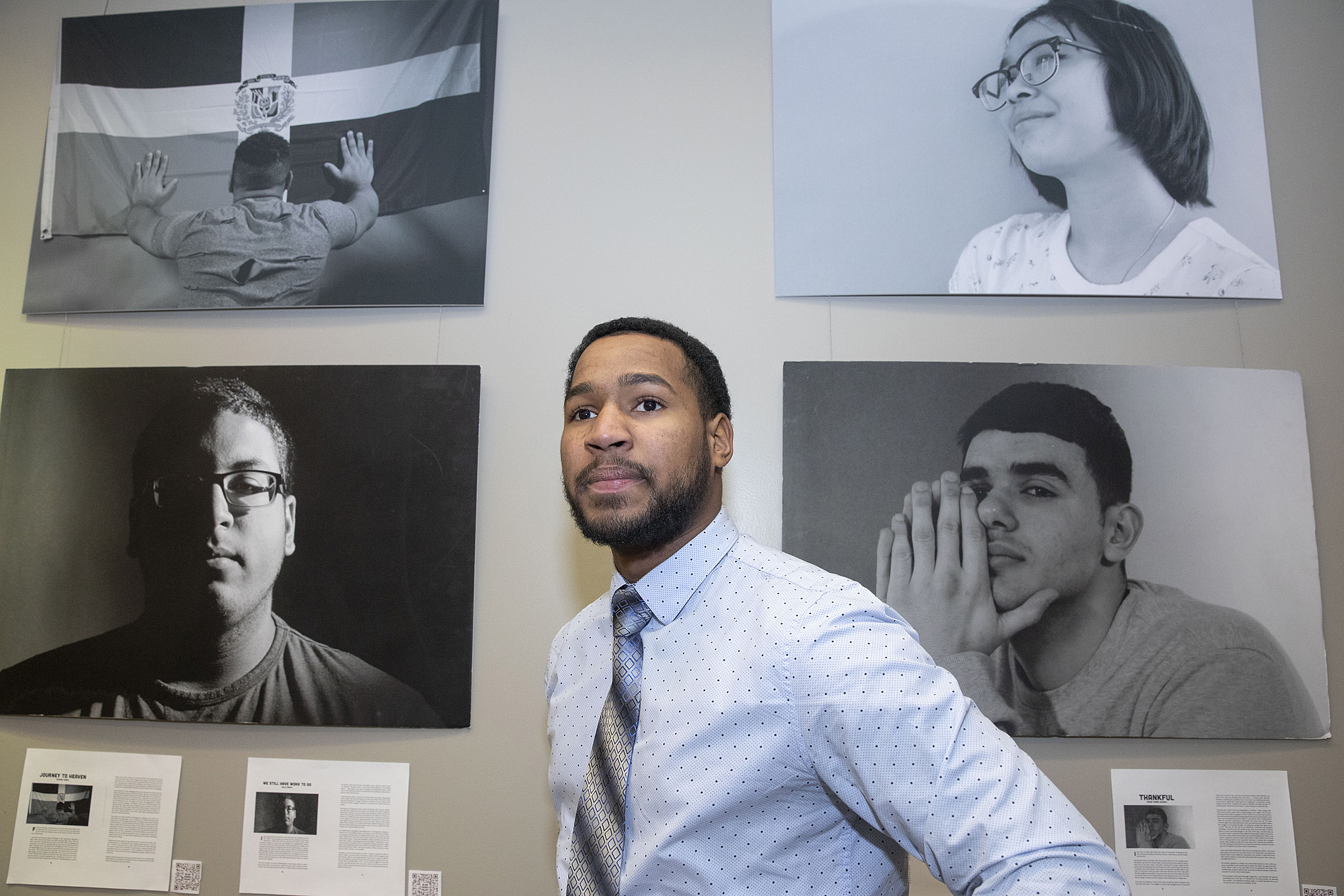 Ezequiel Nunez with "We Are America" portraits.