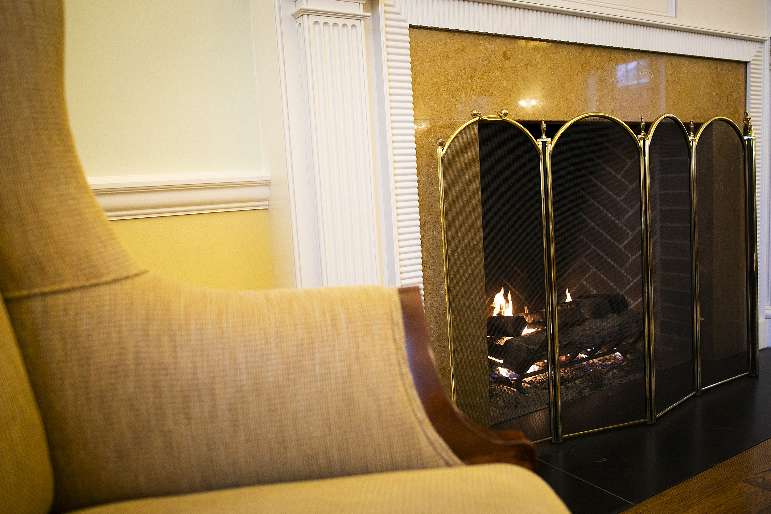 Gold and white fireplace at the Business School.