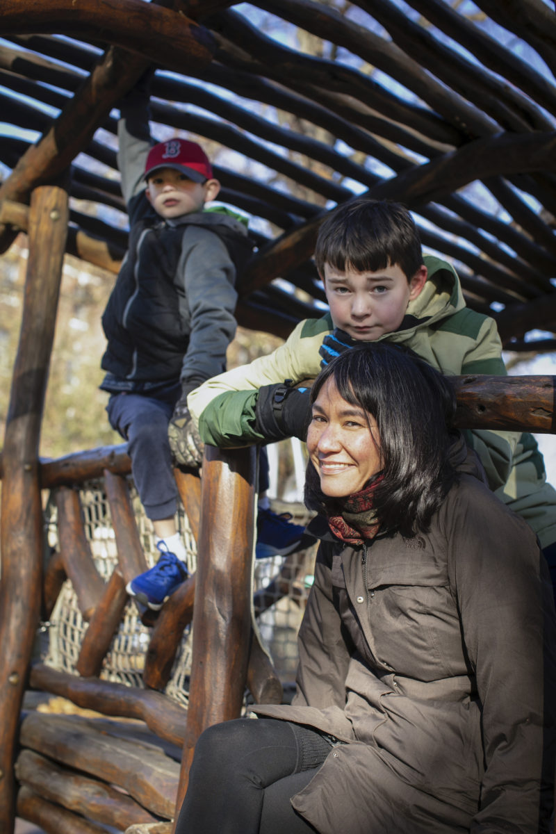 Joan Naviyuk Kane in a barn with her two sons