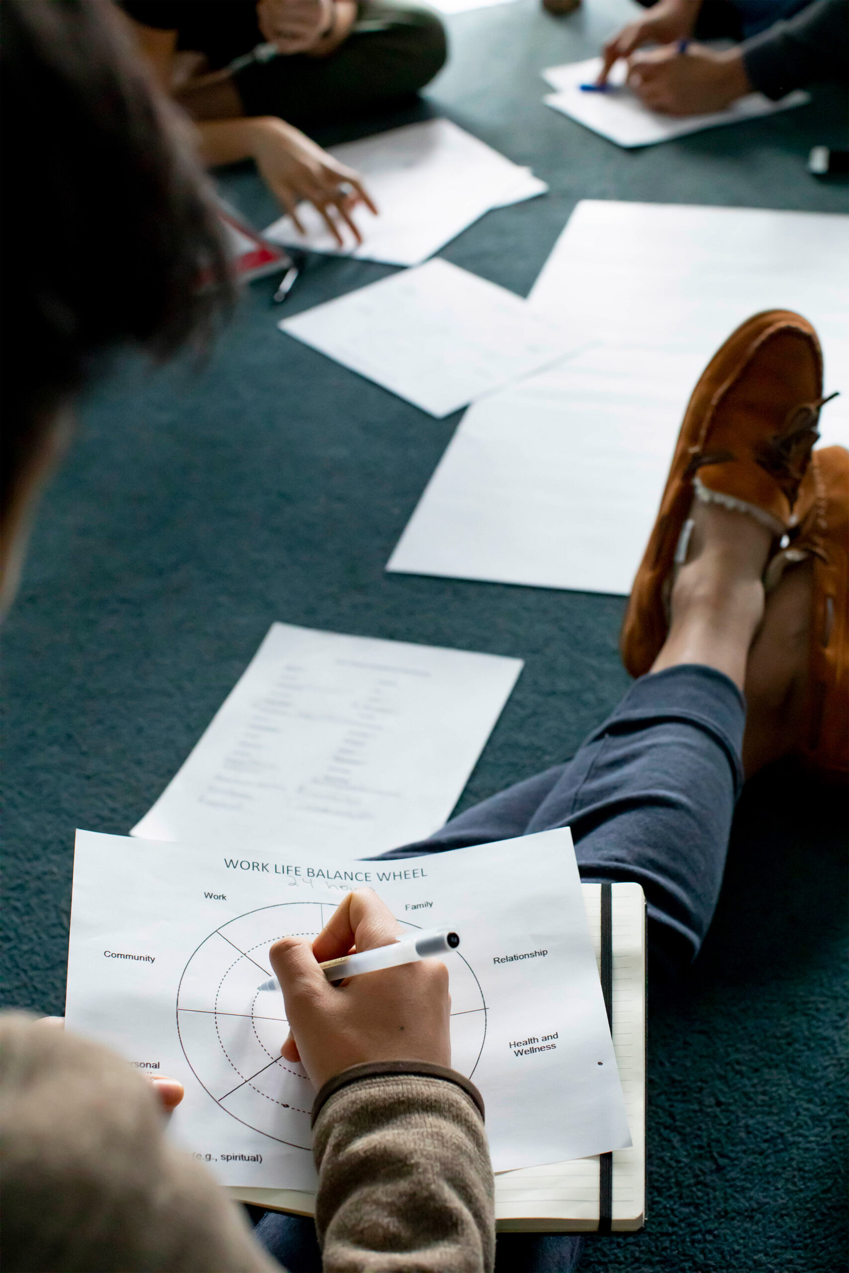 Student filling out worksheet.