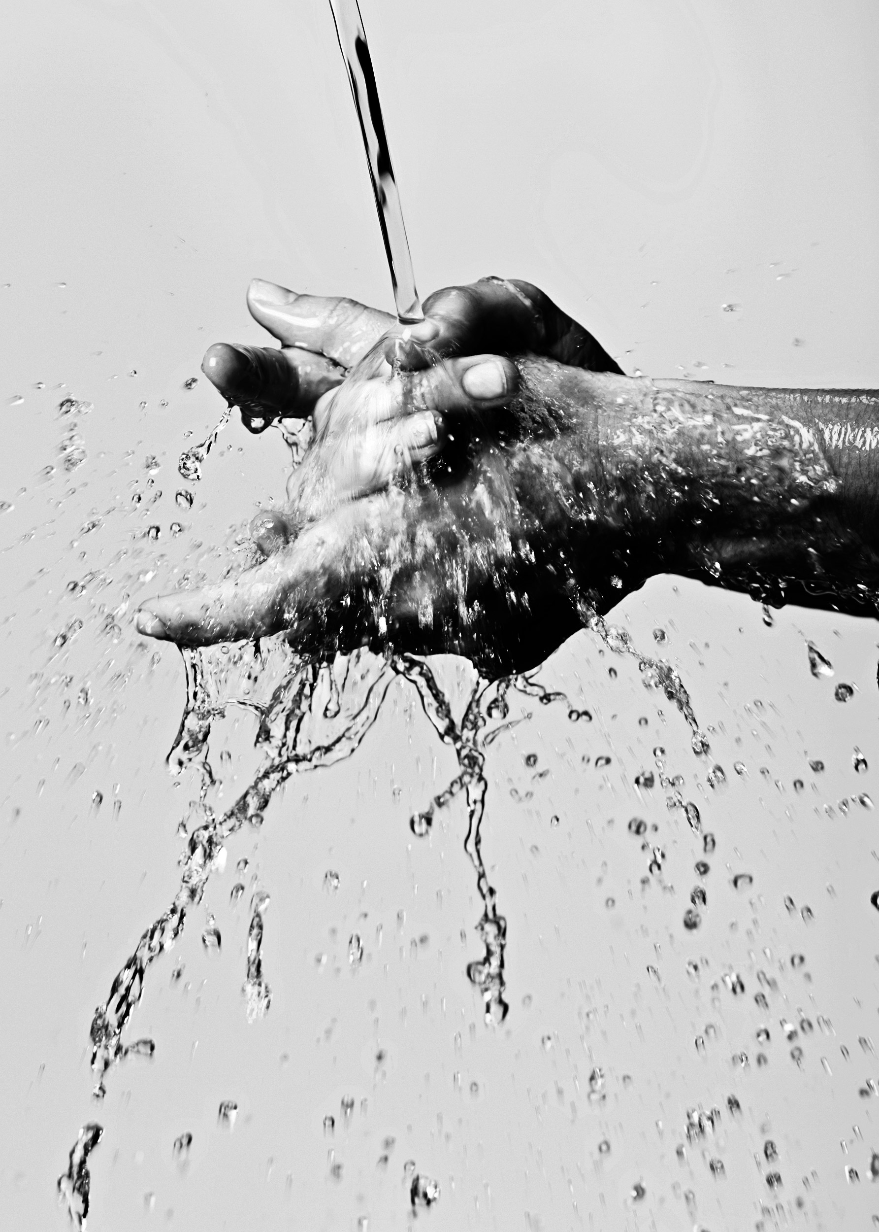 Hands being washed.