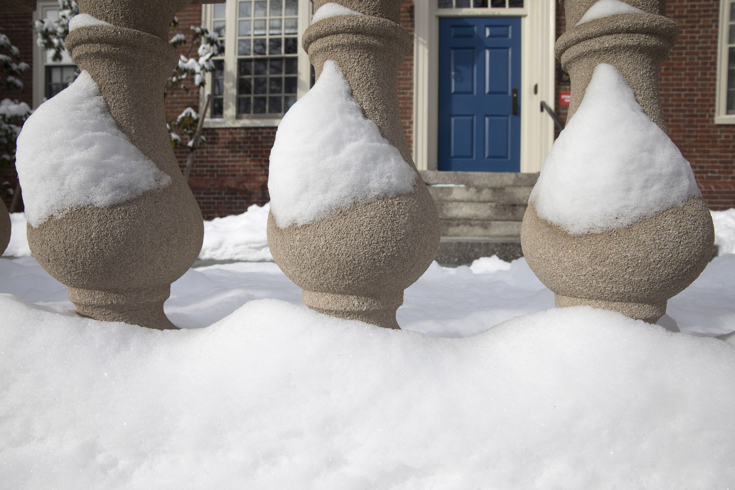 Lowell House columns remain frosted with snow after a storm.