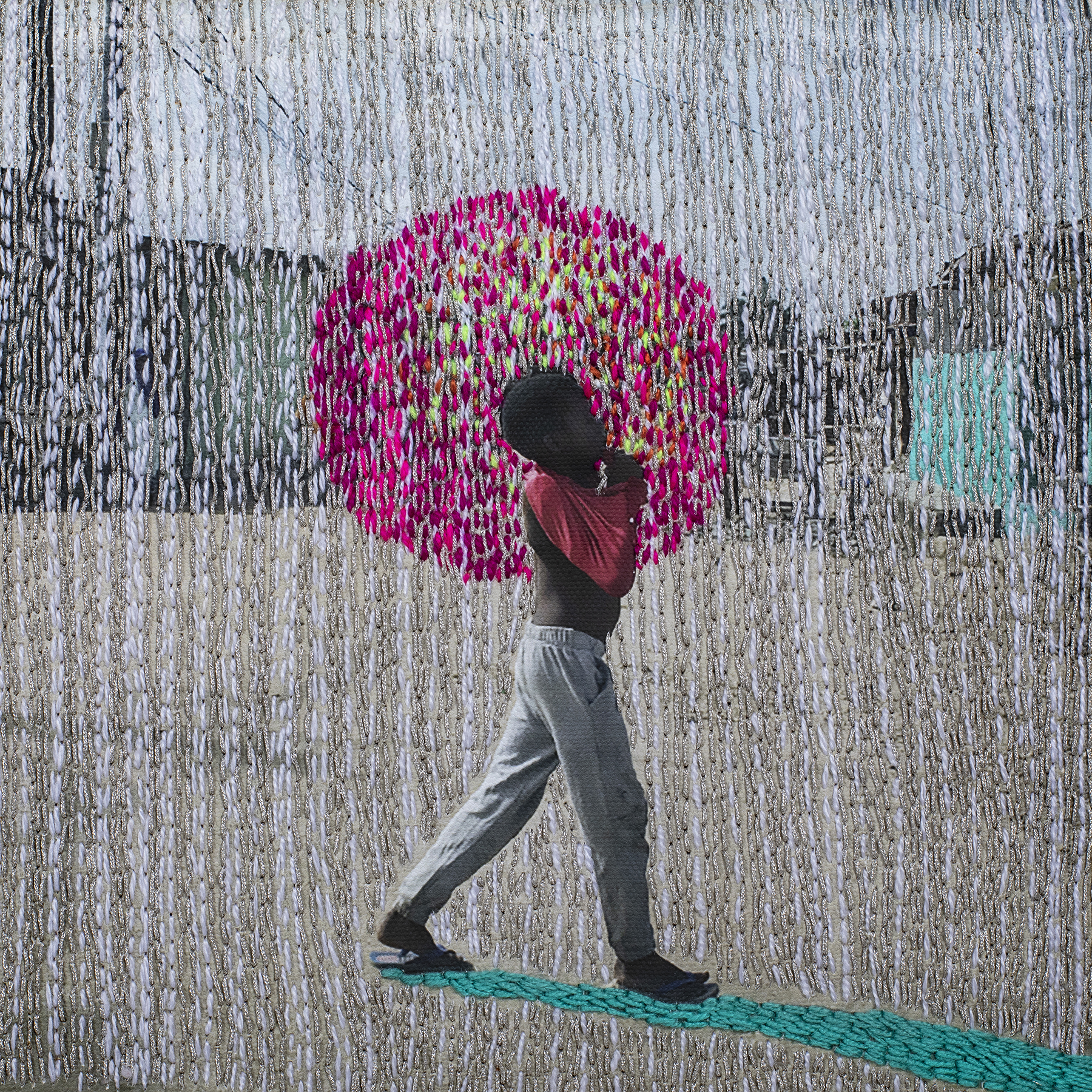 Embroidered photograph of boy walking.