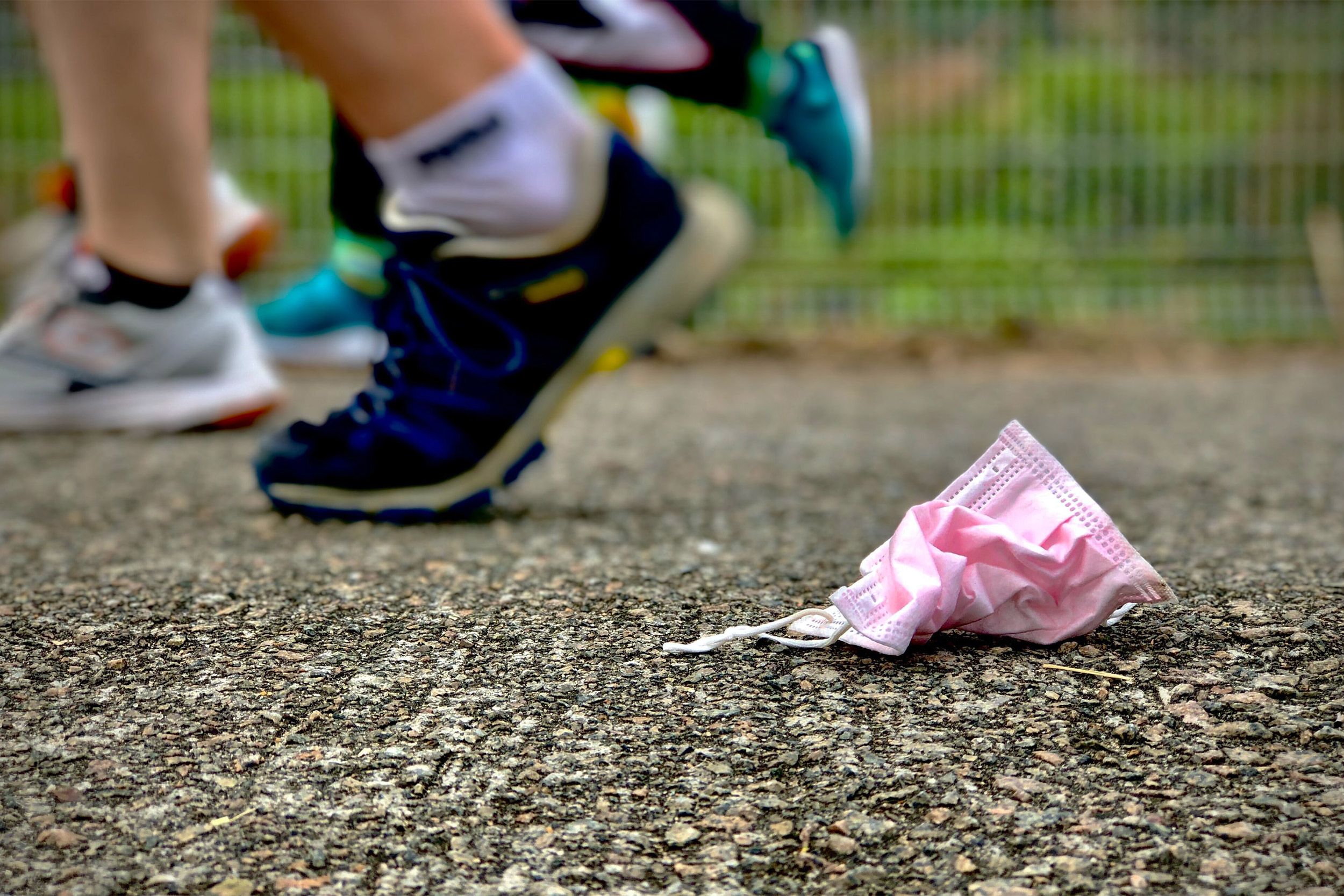 Runners and mask on ground.