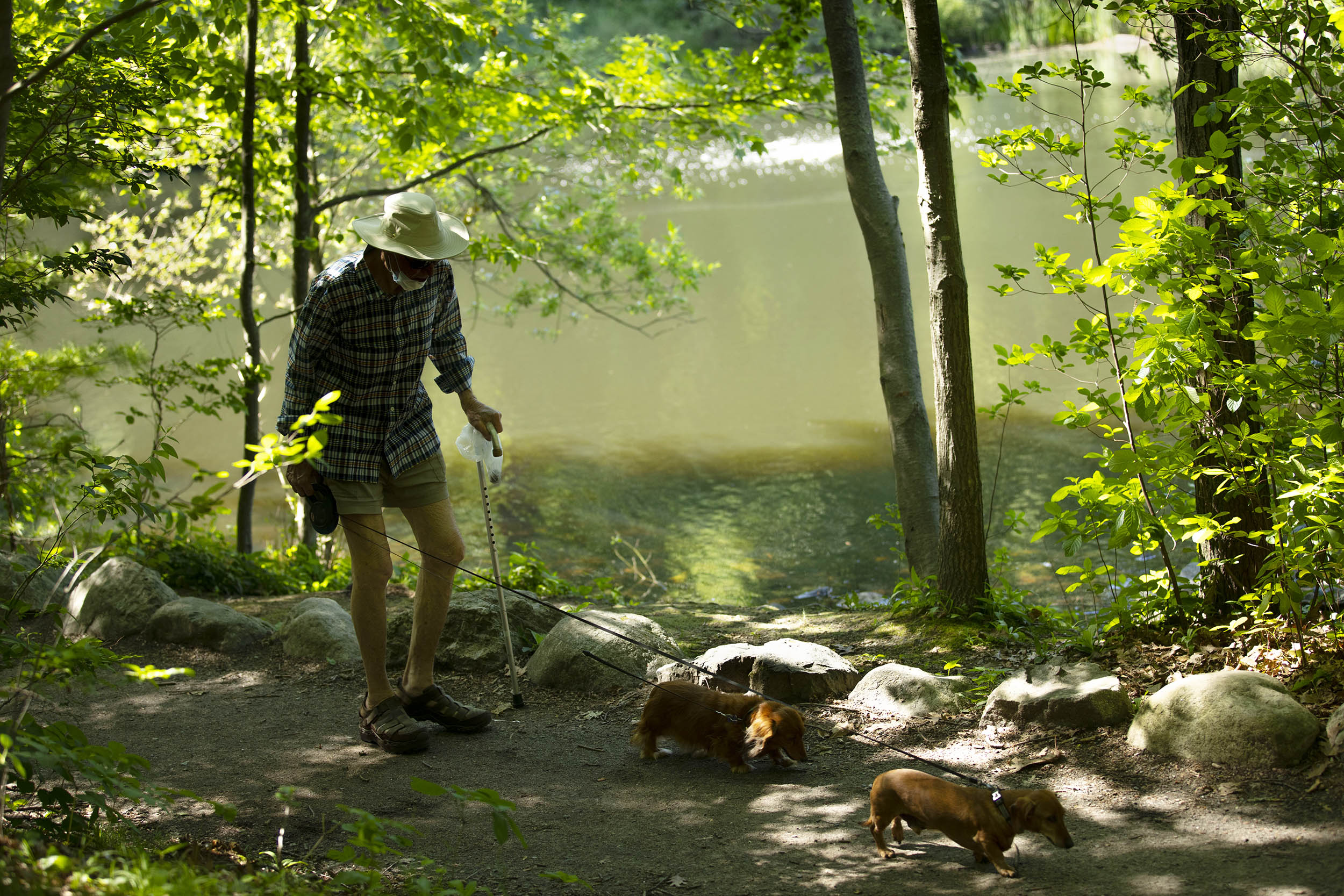 Man walks with cane.