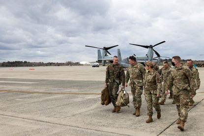 Tucceri walking with the National Guard