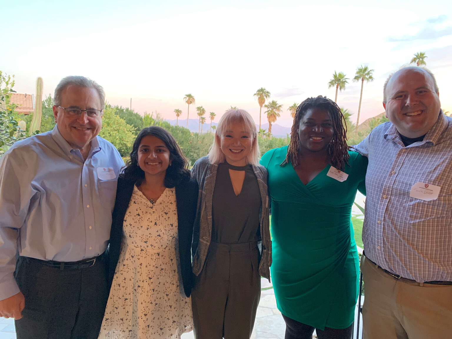 Group photo of Venkataramanan and Kim (center) with three other people