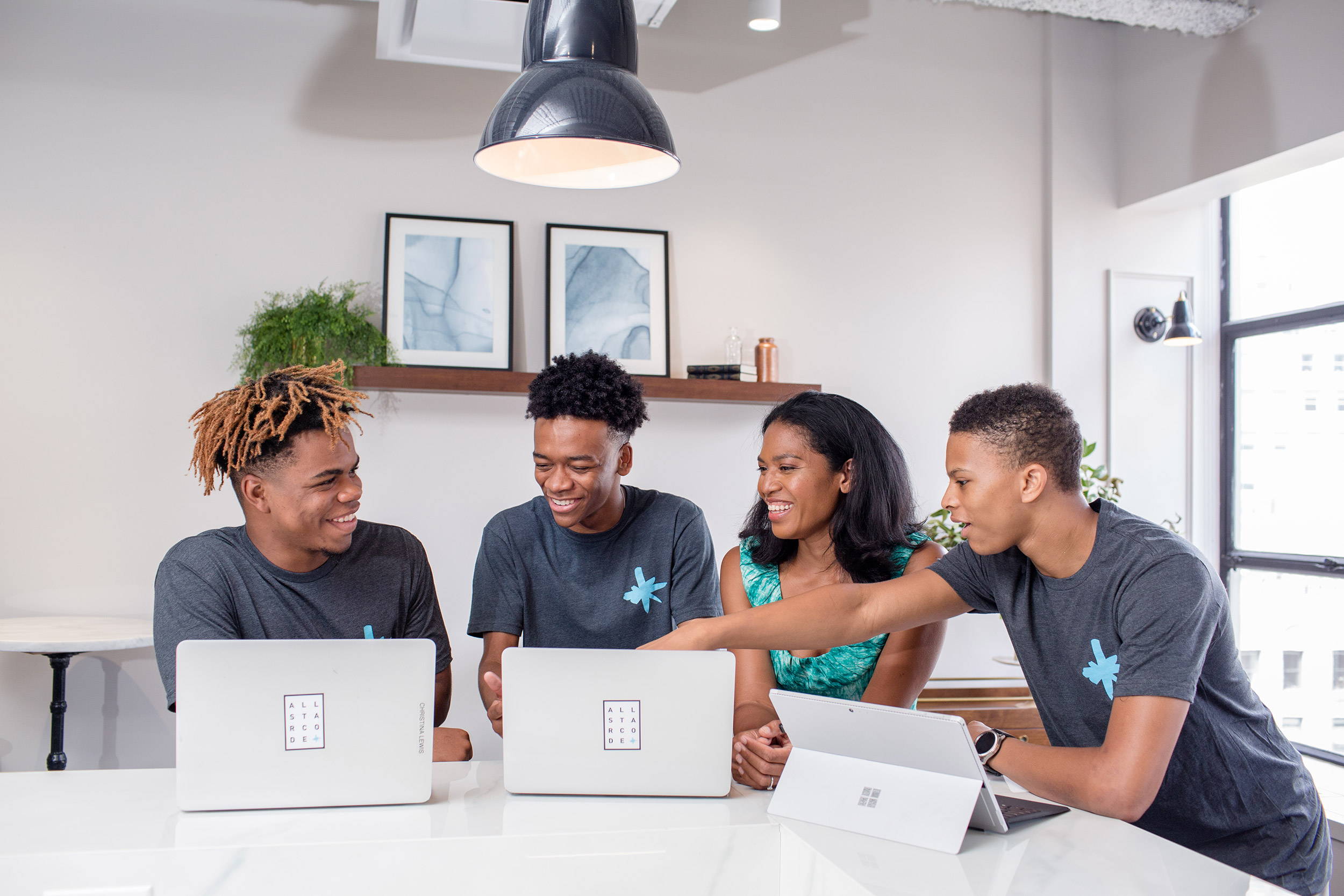 Group of people working at laptops.