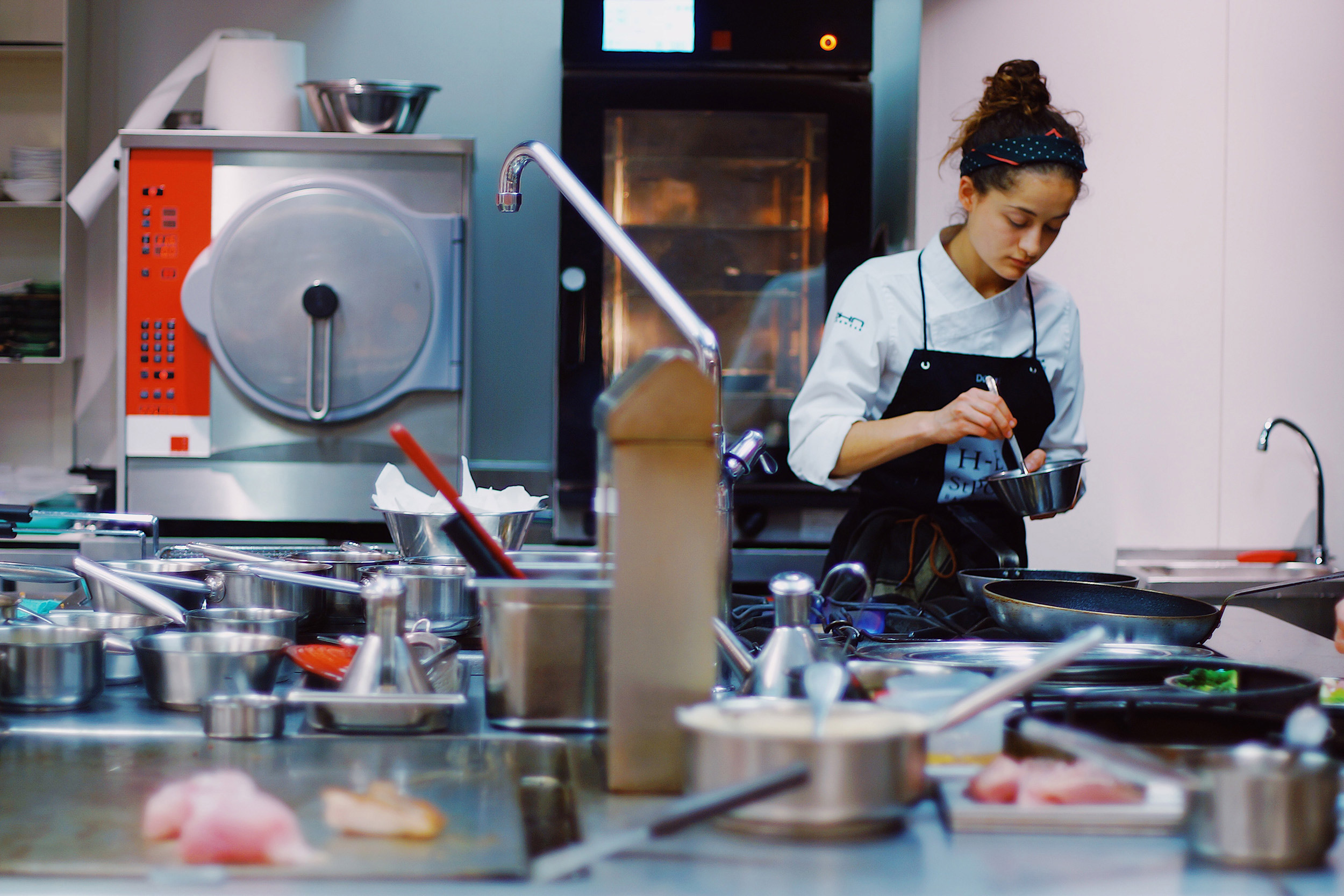 Woman cooking professionally.