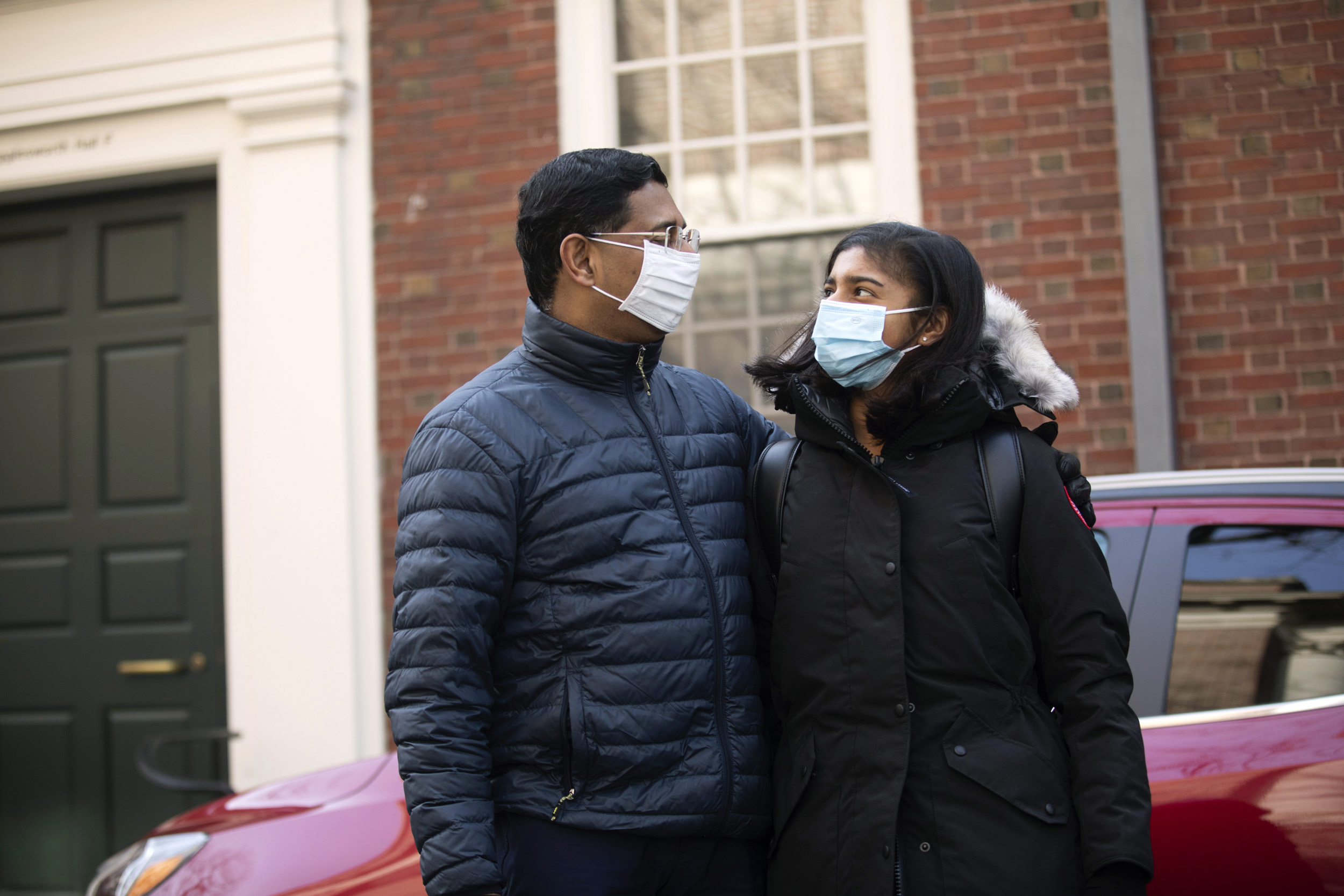 Two people in masks.