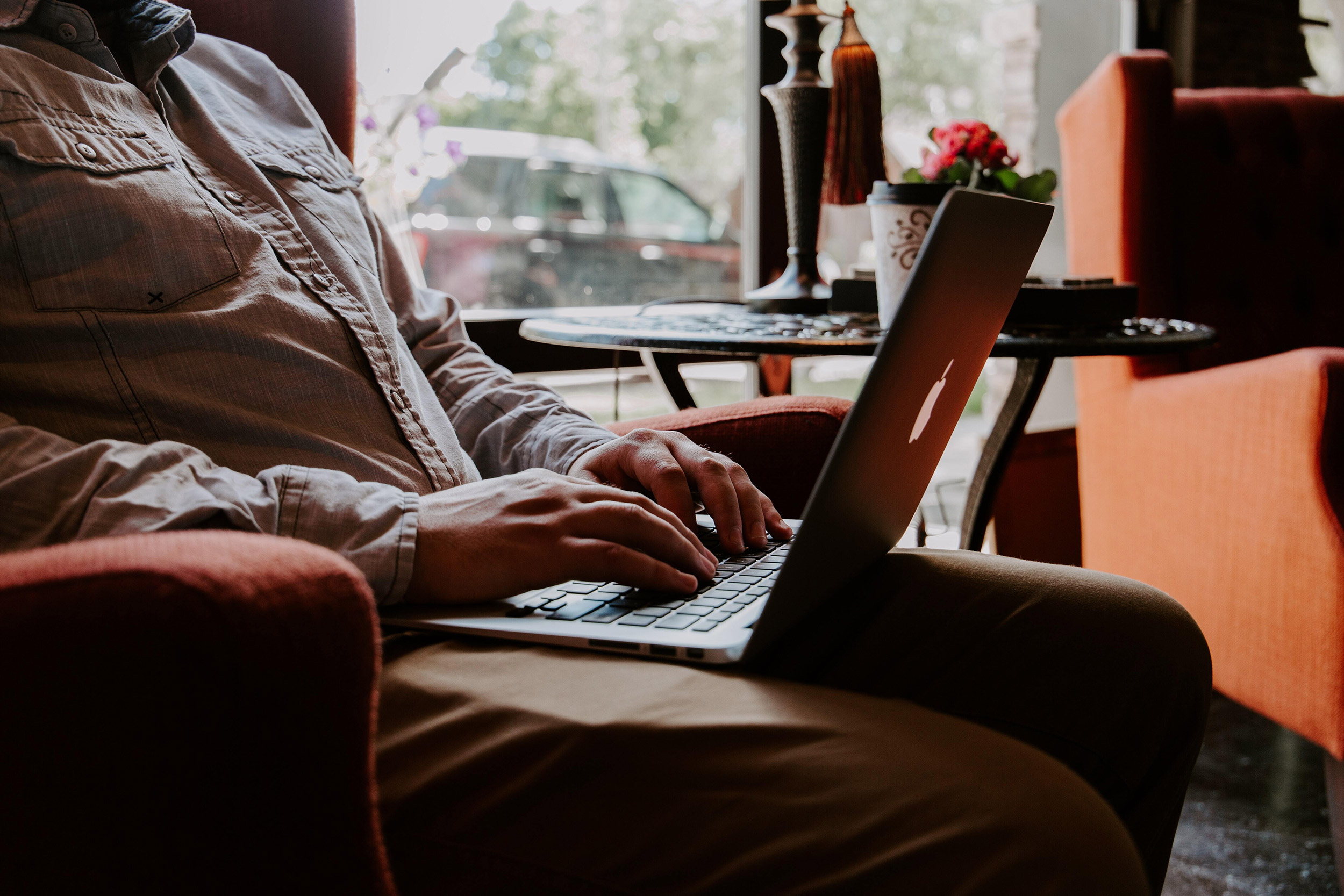 Man working on computer in casual setting.