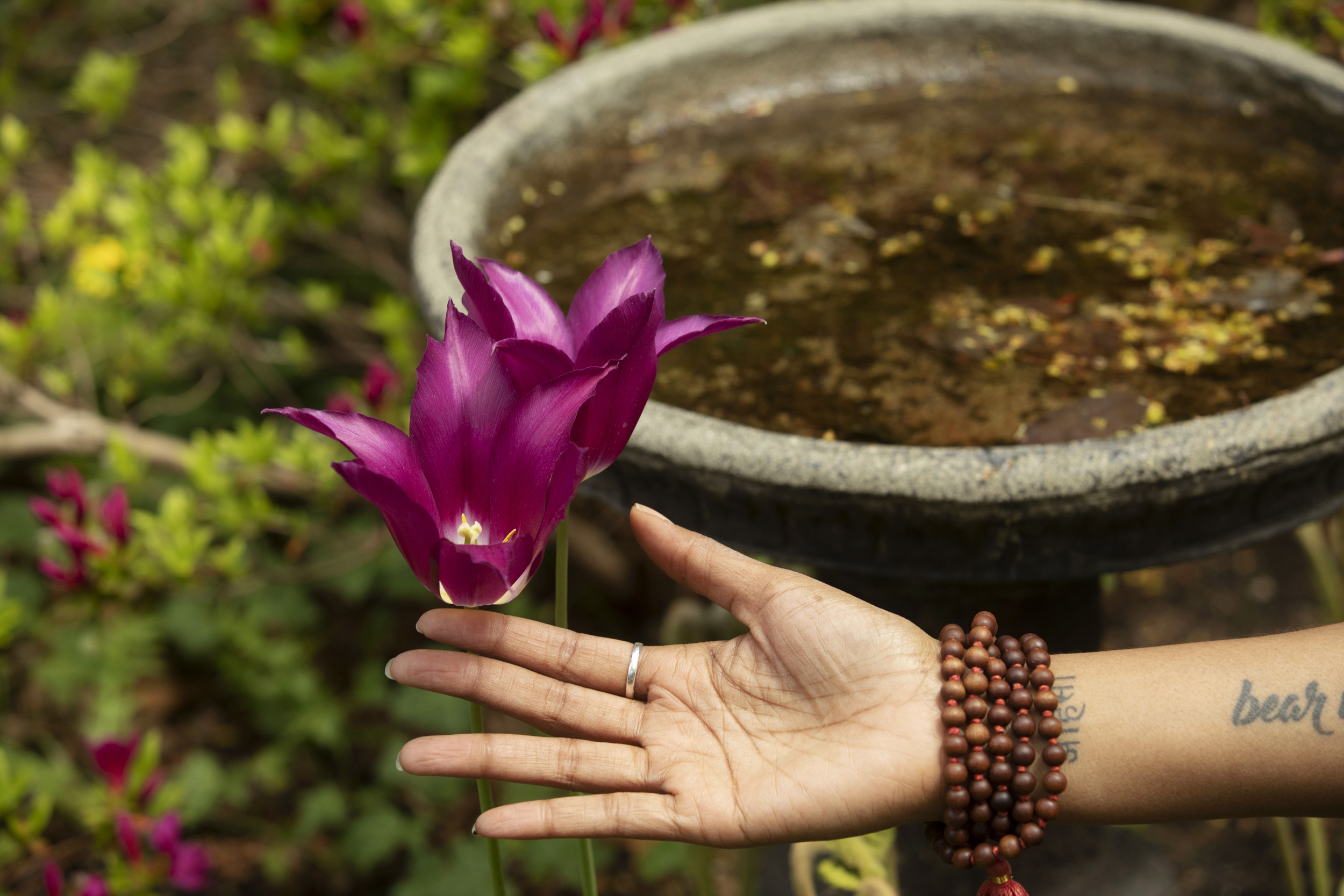 Jessica Chang practices yoga showing a flower blossom.