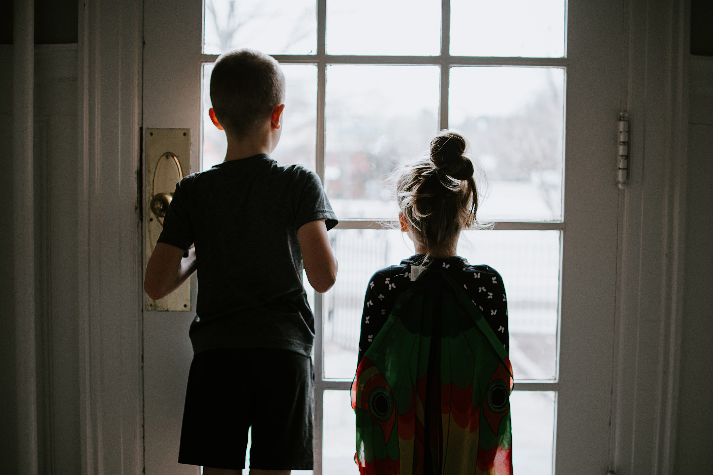 Children looking out the window.