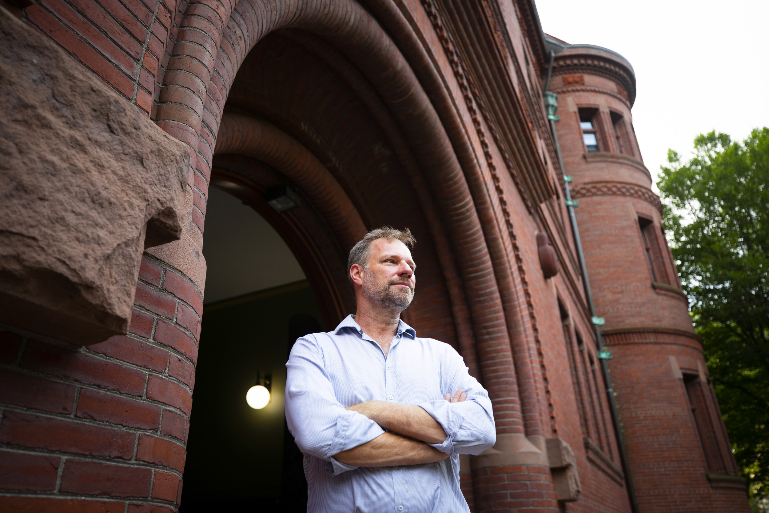 Fanny Peabody Professor of Music Alex Rehding speaks about a new book he co-authored on the Golden Record and a new approach to music theory. He is pictured outside the acoustically-designed archway of Sever Hall in Harvard Yard at Harvard University.